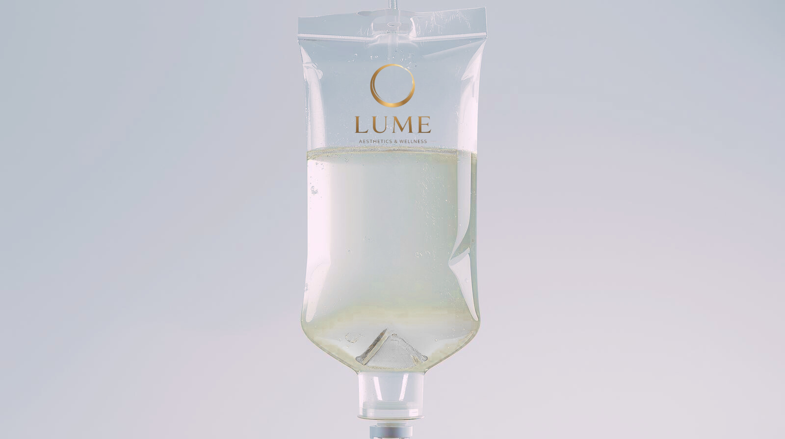 A transparent IV bag labeled 'LUME Aesthetics & Wellness' filled with a clear liquid against a light background.