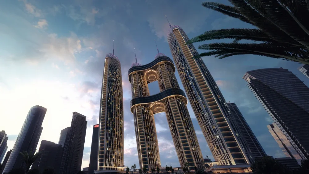 A group of modern skyscrapers with unique, curvy designs and illuminated features against a twilight sky in an urban cityscape, with palm trees in the foreground.