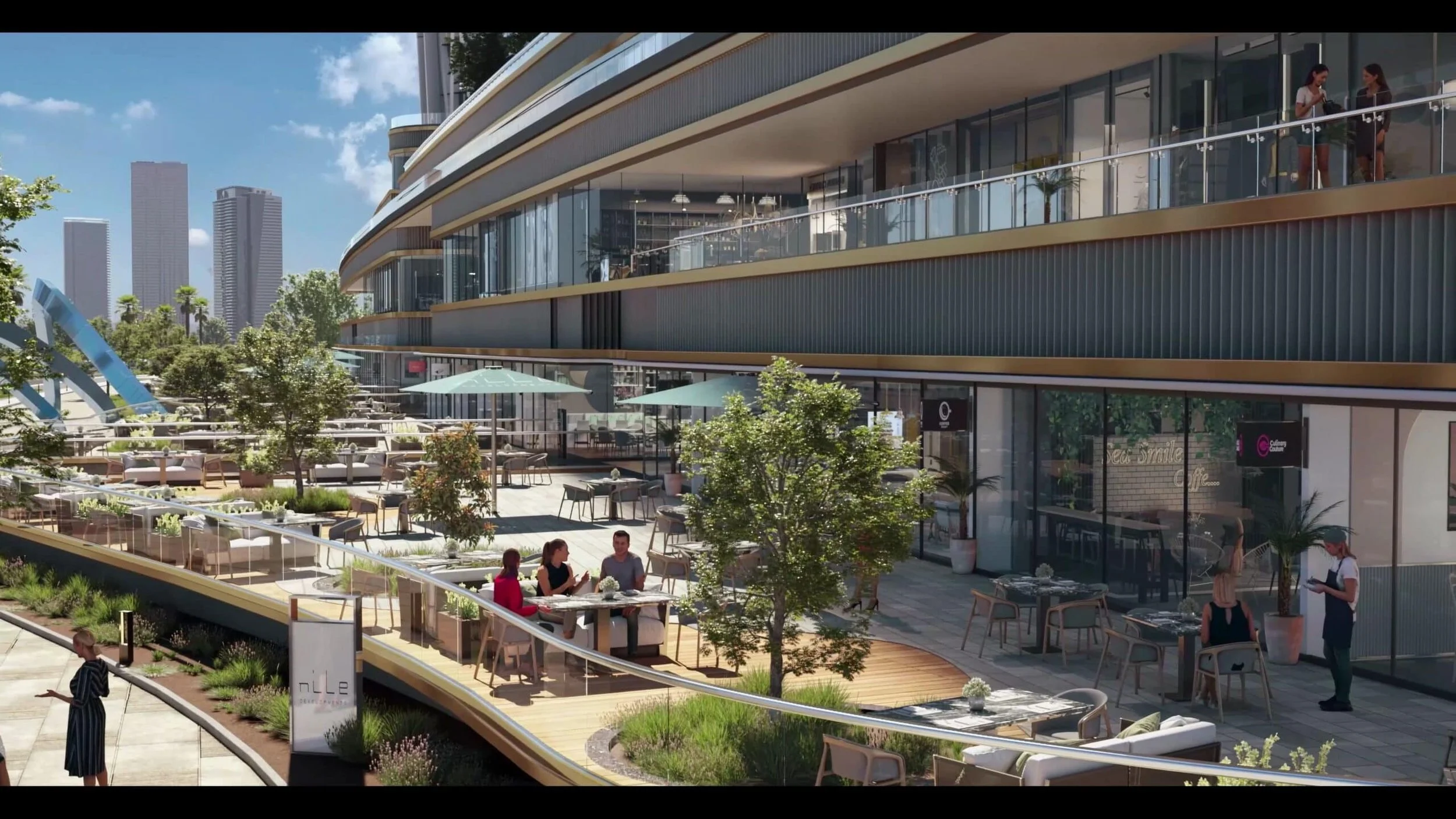 Outdoor dining area on a modern multi-story building terrace with tables, chairs, umbrellas, trees, and people dining and walking, city skyline in the background.