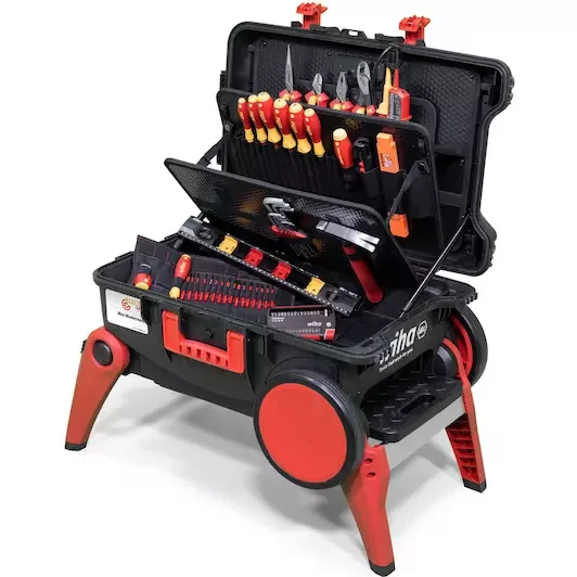 A portable black and red toolbox containing various hand tools such as screwdrivers, pliers, a wrench, and a measuring tape.