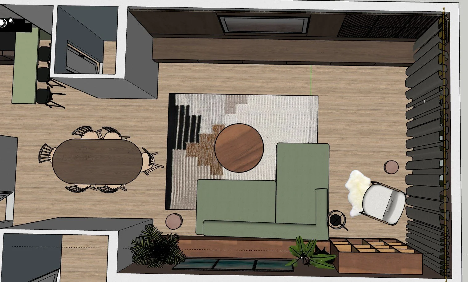 Top-down view of a living room with a green sofa, round coffee table, patterned rug, armchair with a sheepskin throw, and a jazz pipe wall with potted plants and a wooden storage unit.