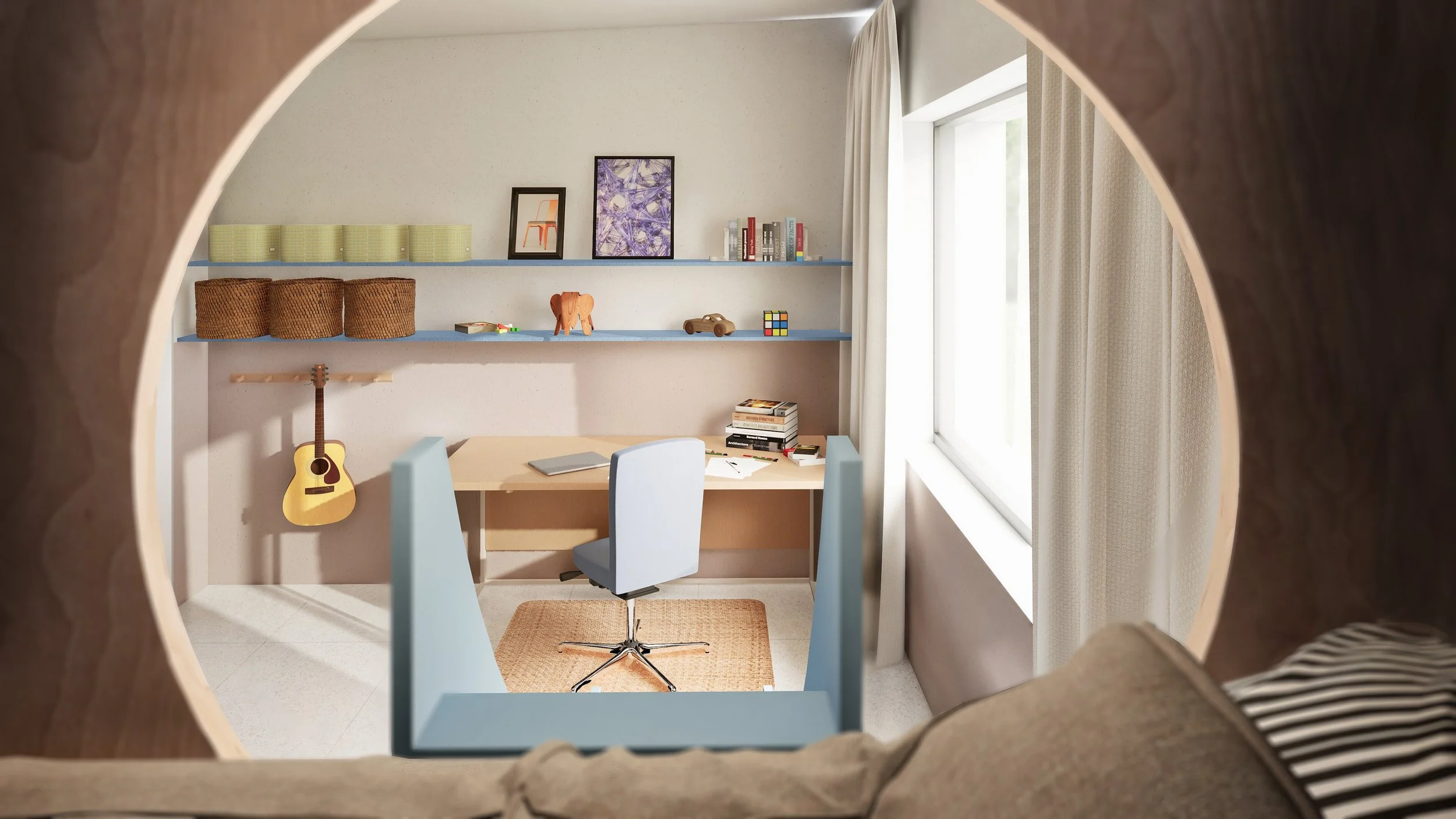 View of a cozy home office seen through a circular window. The room features a desk with a chair, books, papers, and a laptop. Shelves hold baskets, books, and decorative items including a small sculpture, a rubik's cube, and framed pictures. A guita