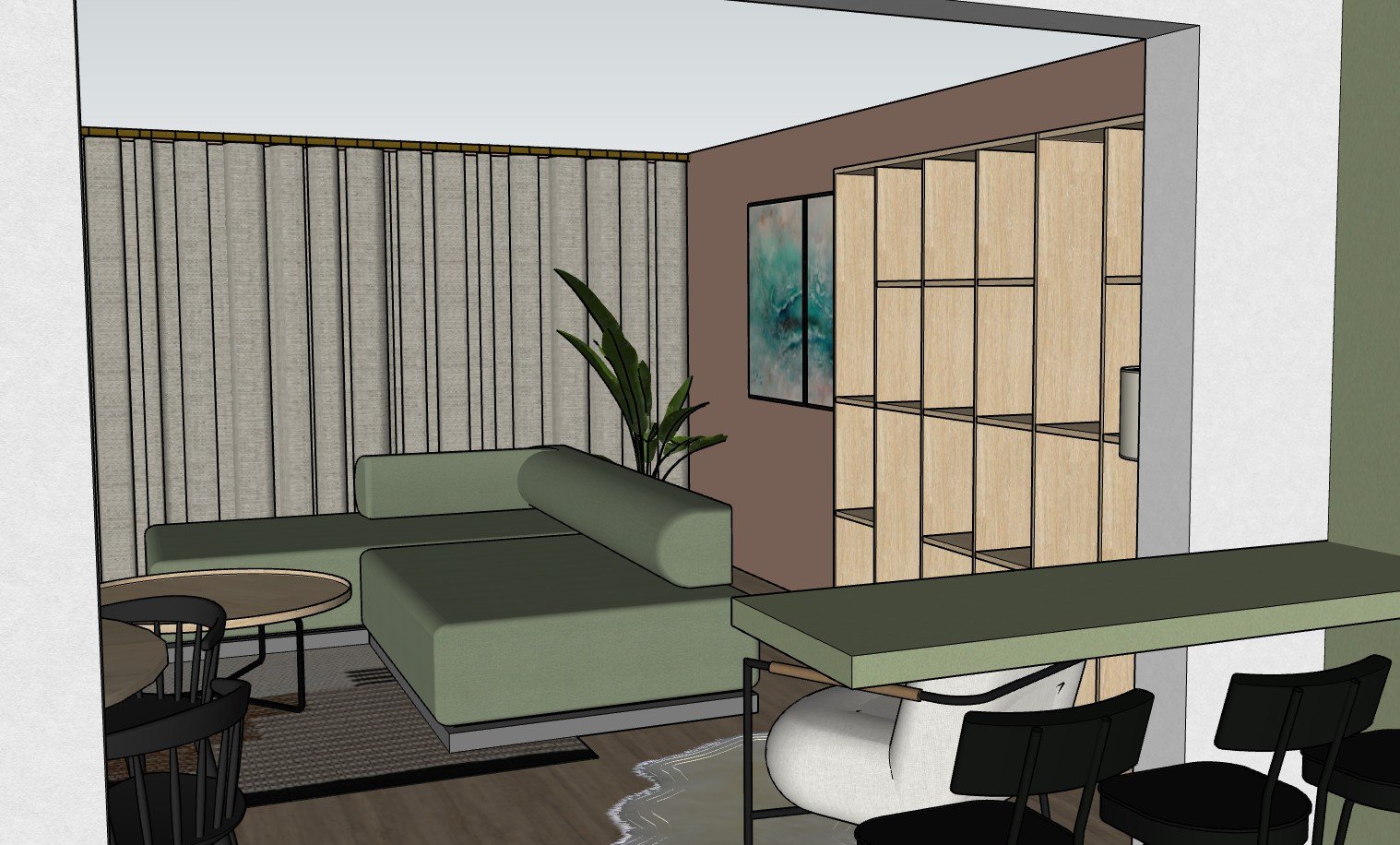 A modern living room with a green sectional sofa, a small round coffee table, potted plant, abstract art on the wall, light wood shelving unit, and a green countertop with black chairs.