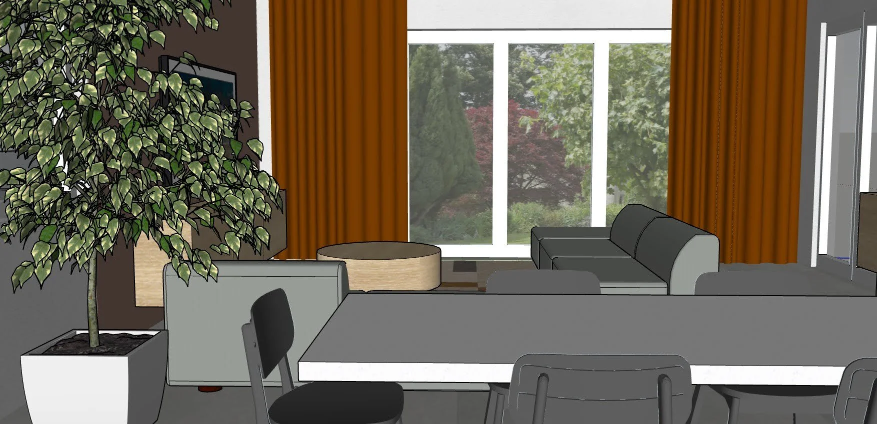 Living room with a large potted plant, a table, gray and black couches, orange curtains, and a large window overlooking a garden with trees.