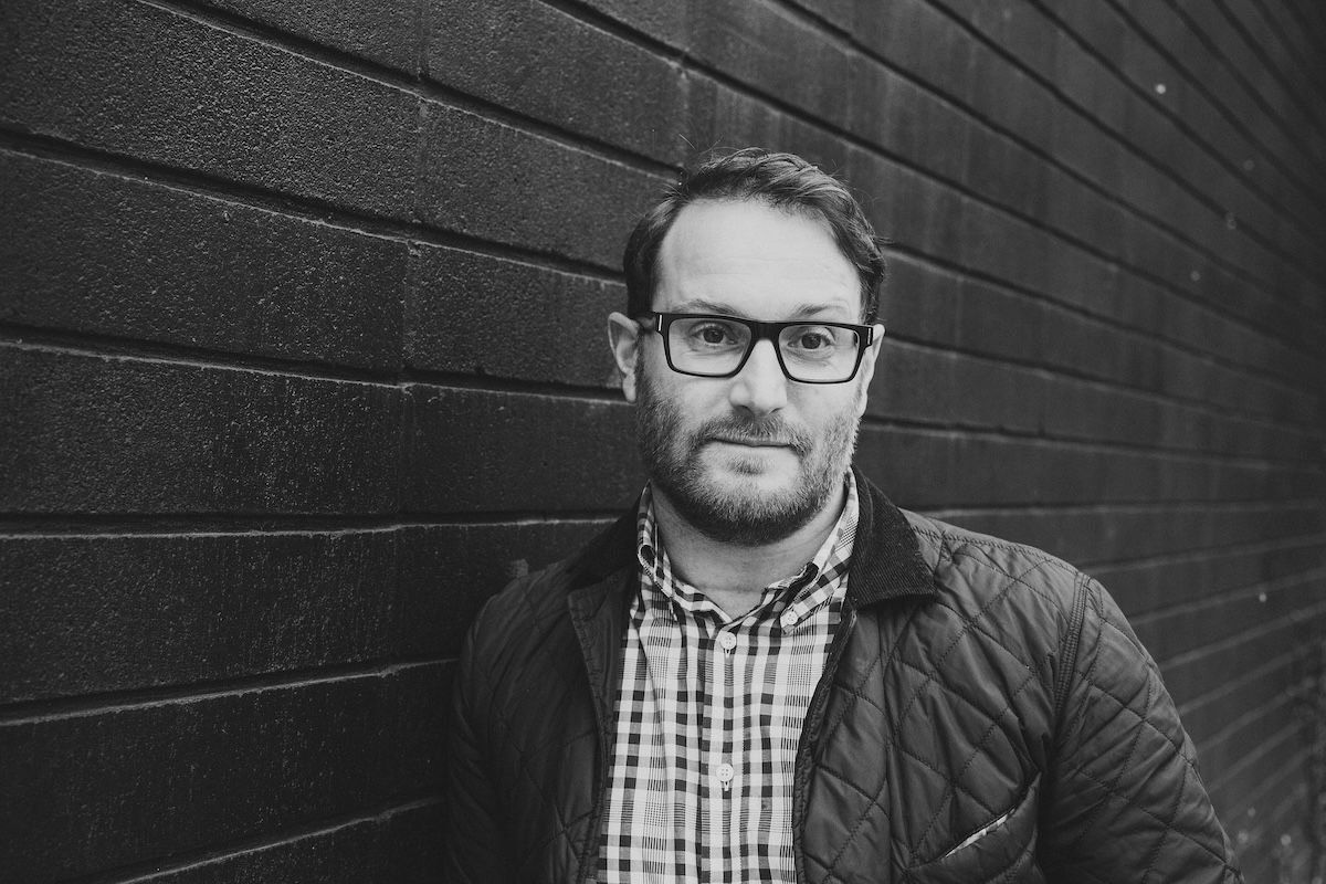 Black and white headshot of Nicholas, realtor specializing in waterfront properties for sale on Vancouver Island and BC, offering expert guidance in real estate transactions.