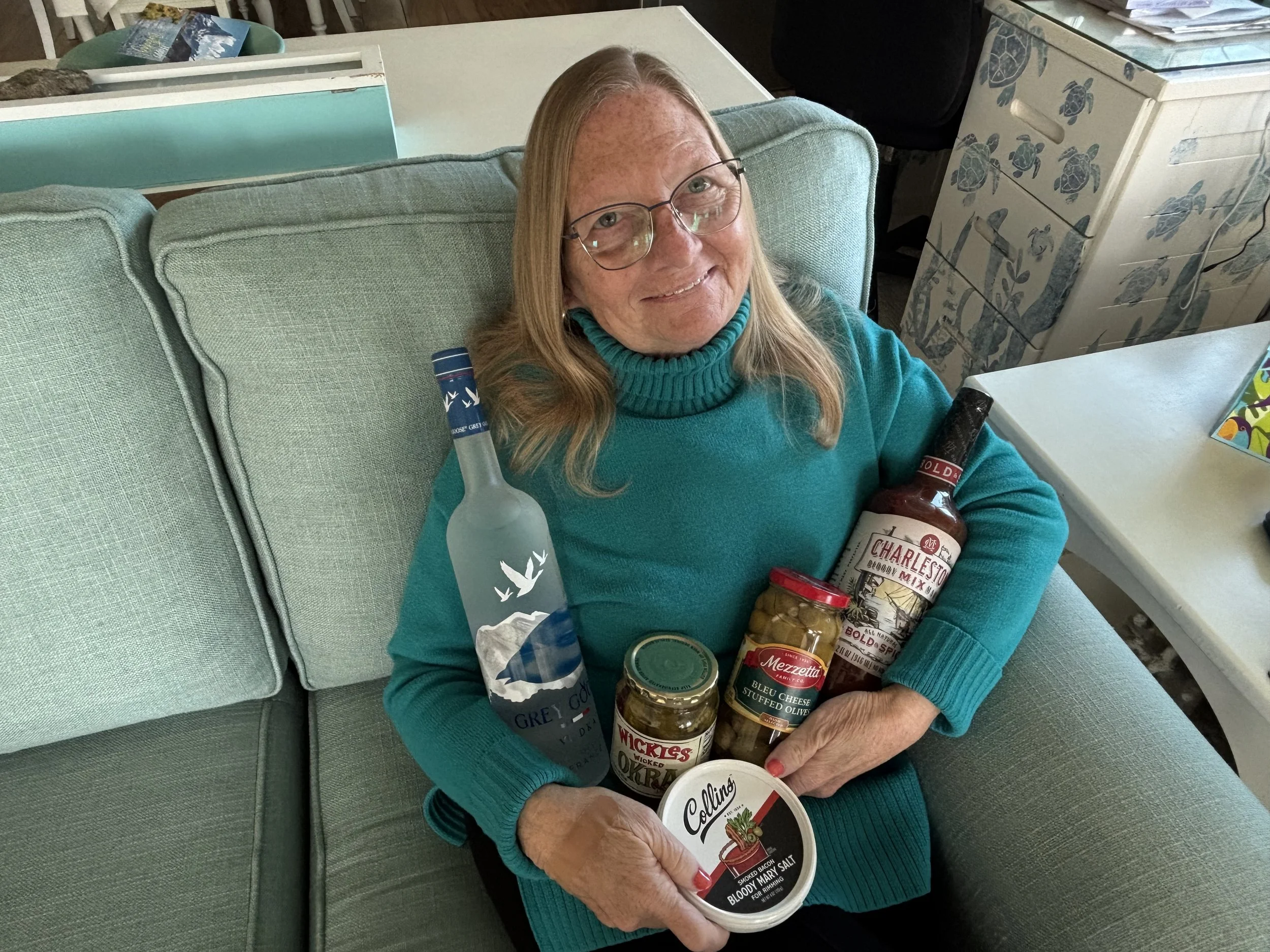 Volunteer MaryBeth was high bidder on the Bloody Mary Basket!