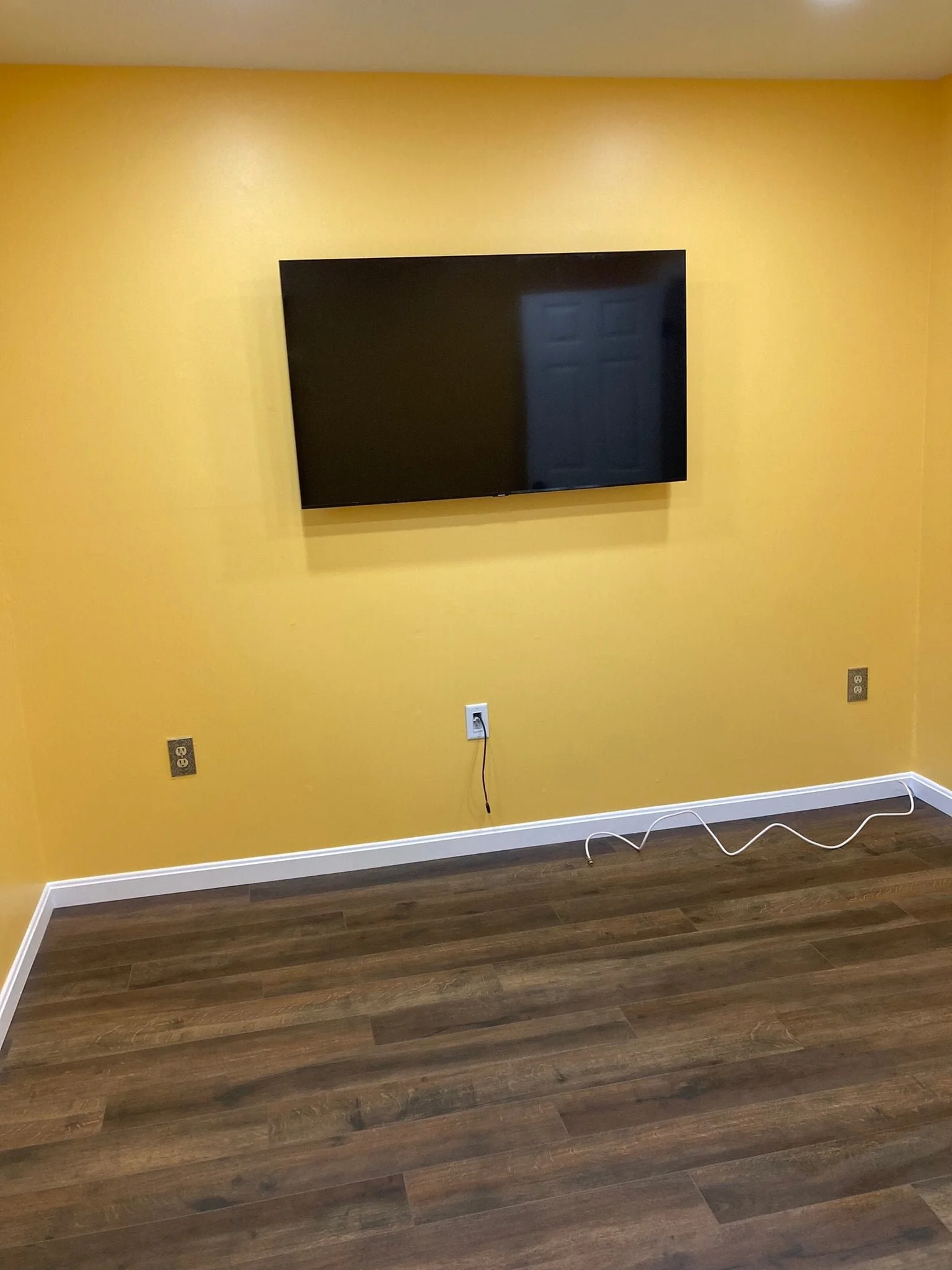 Complete room renovation, drywall, painting, tv mounting, recessed lighting by Sinicki Home Improvements