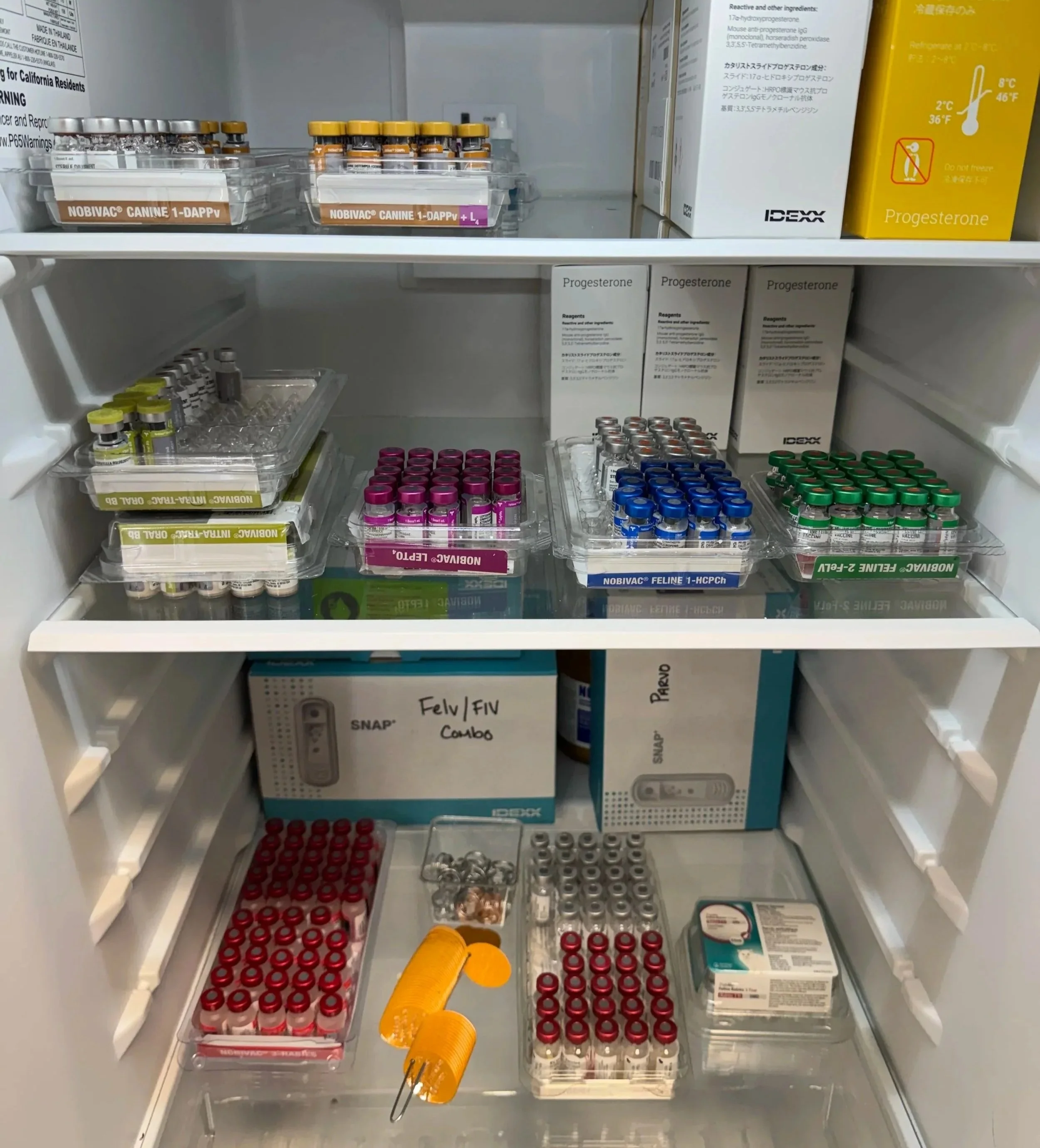Open veterinary supply cabinet used for pet prescription support at Veterinarian Pet Alliance in Newark, NJ.