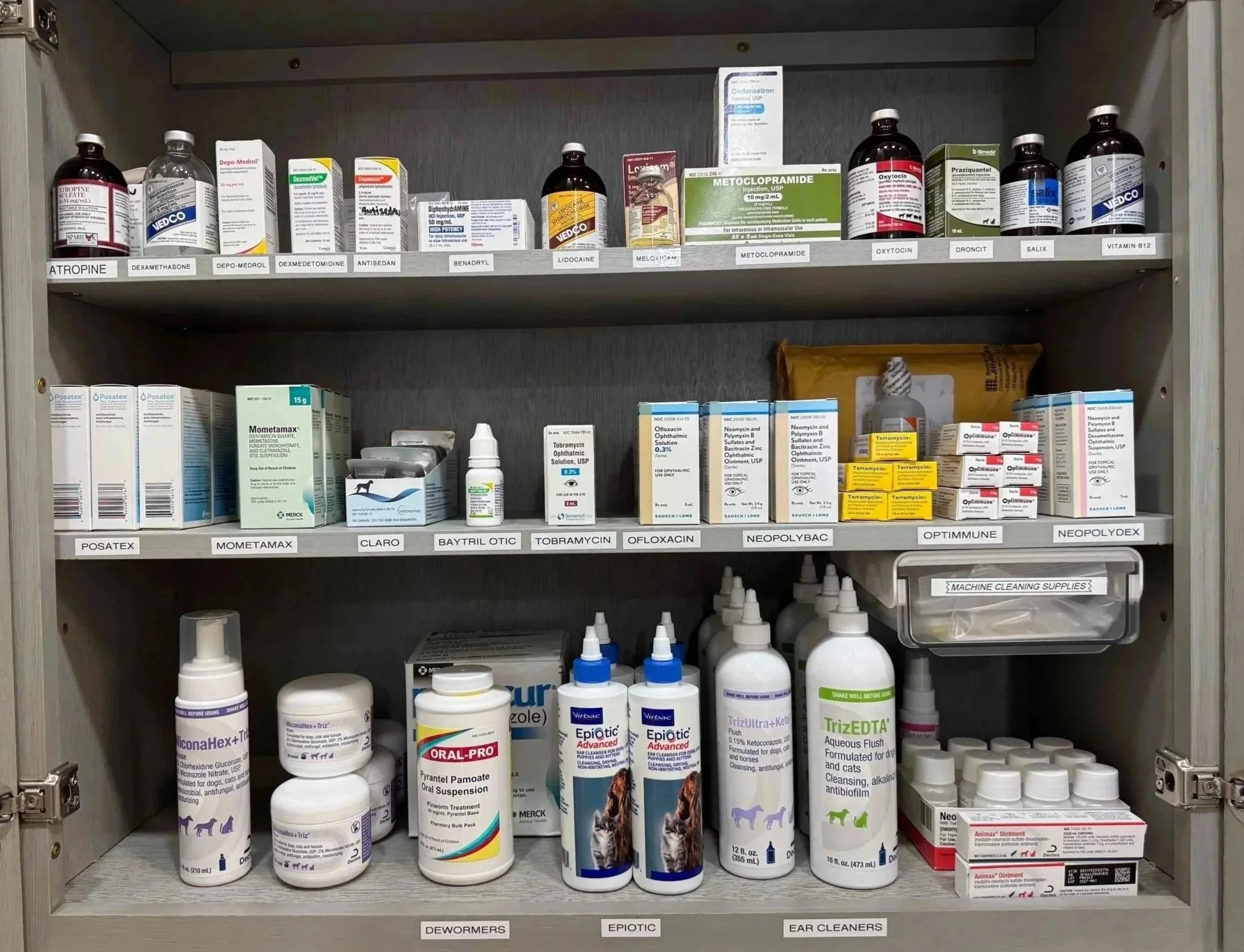 Medication cabinet with veterinary pharmacy products at Veterinarian Pet Alliance in Newark, NJ.