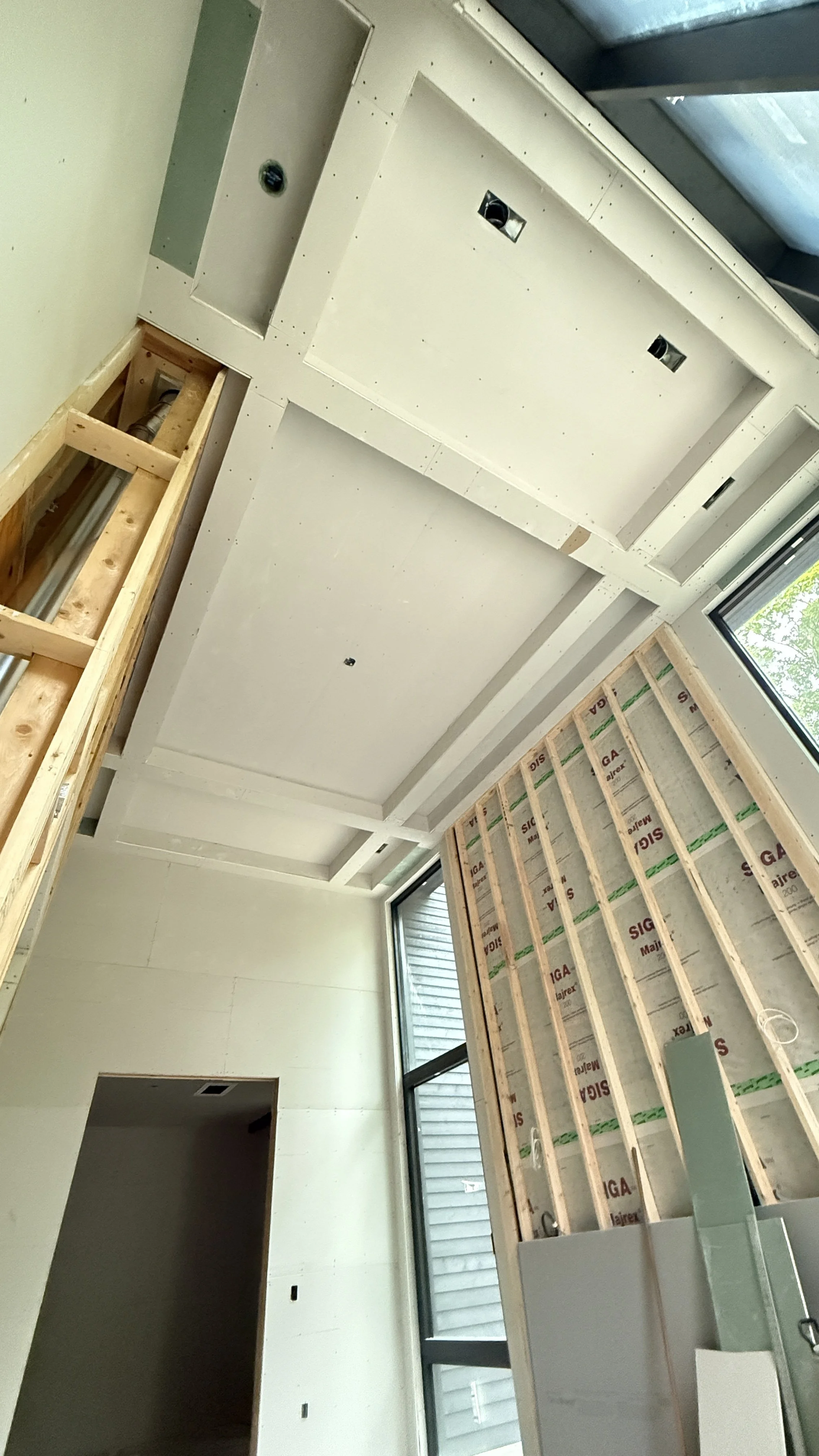 Ceiling and wall drywall installation on high-end residential construction muskoka 