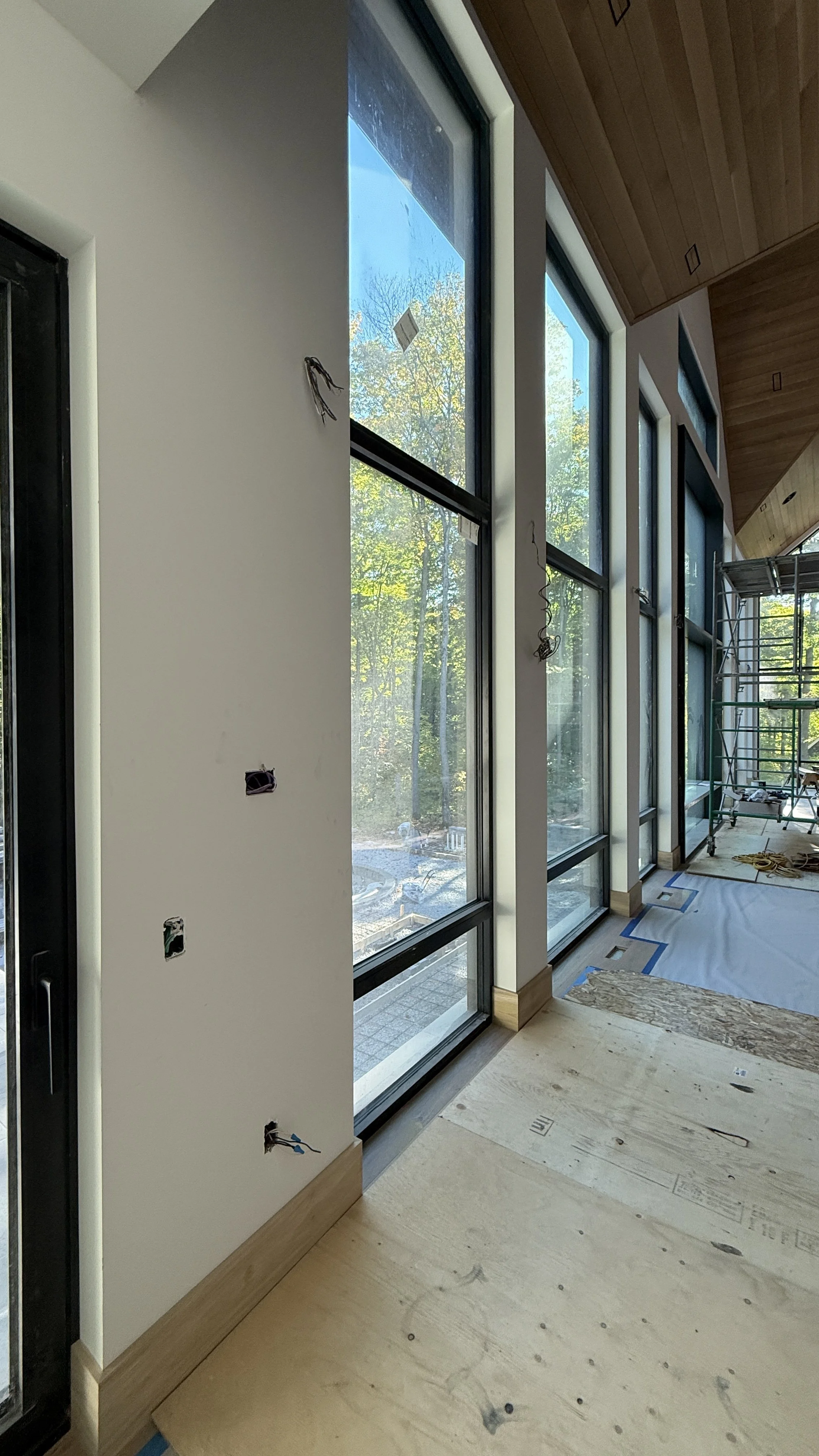 Tall windows with drywall returned windows for a flush modern clean minimalistic drywall look in Muskoka