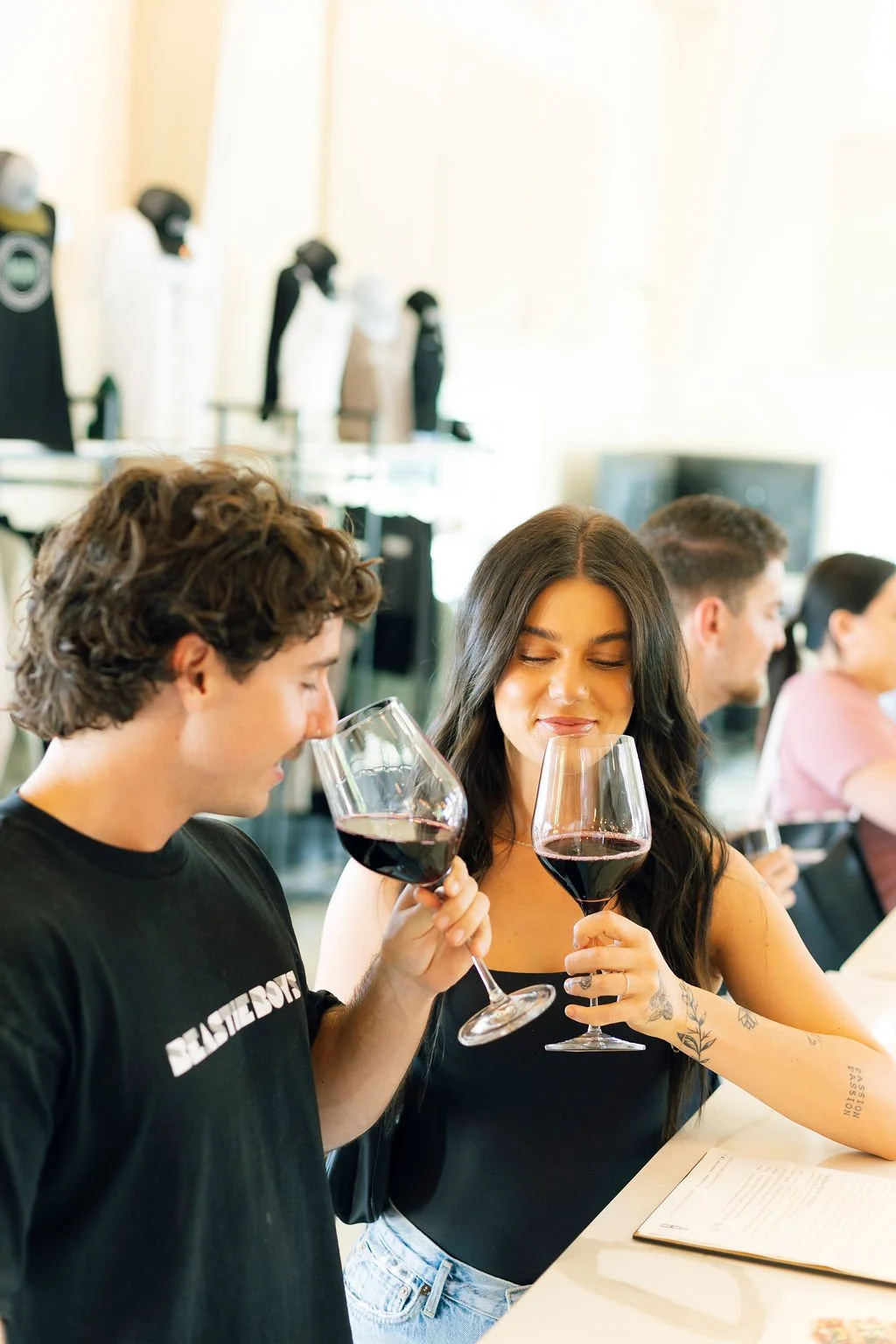 guests enjoying wine at Akash Winery & Vineyards tasting room