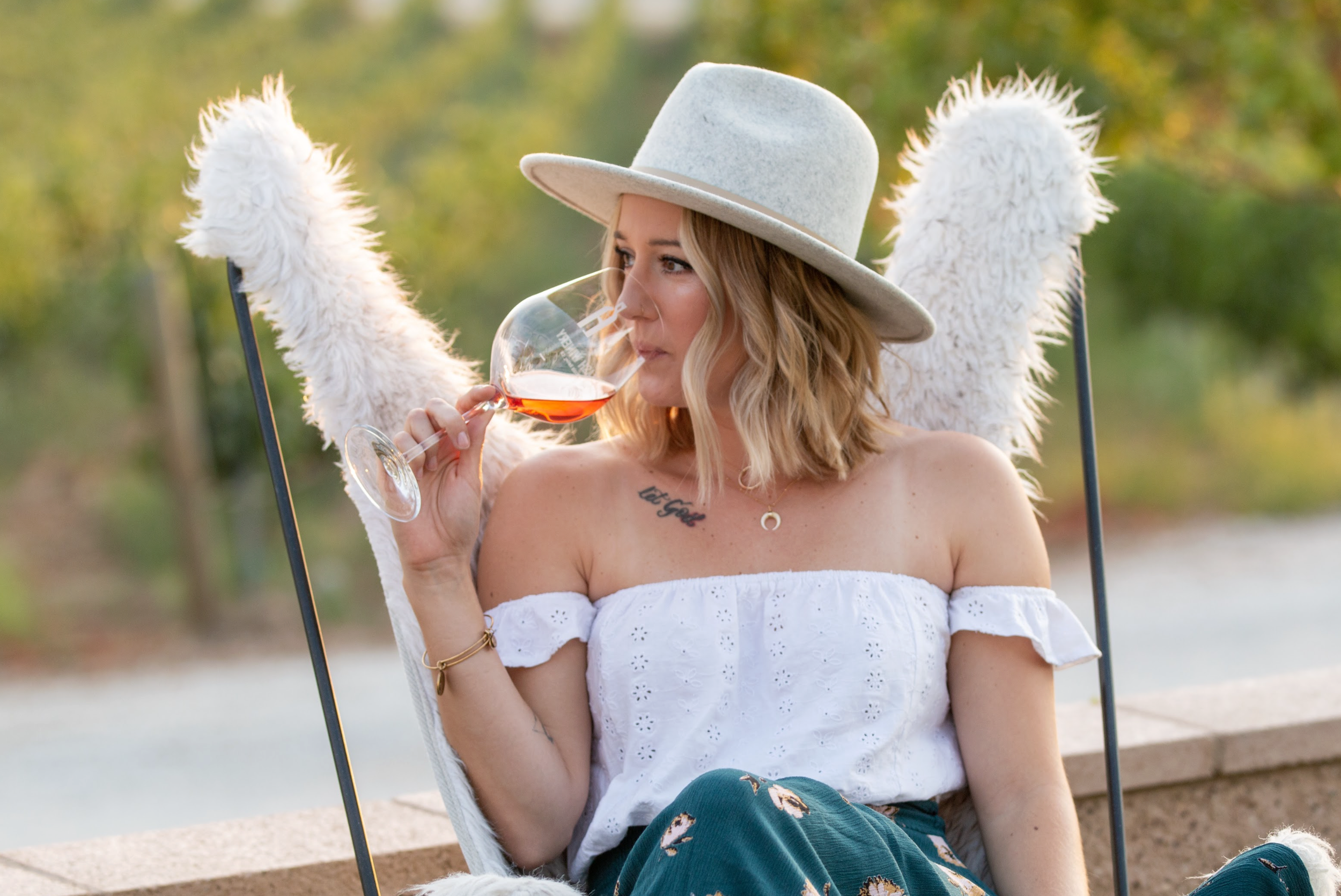 Club Sympa wine member at Akash Winery drinking wine on the patio