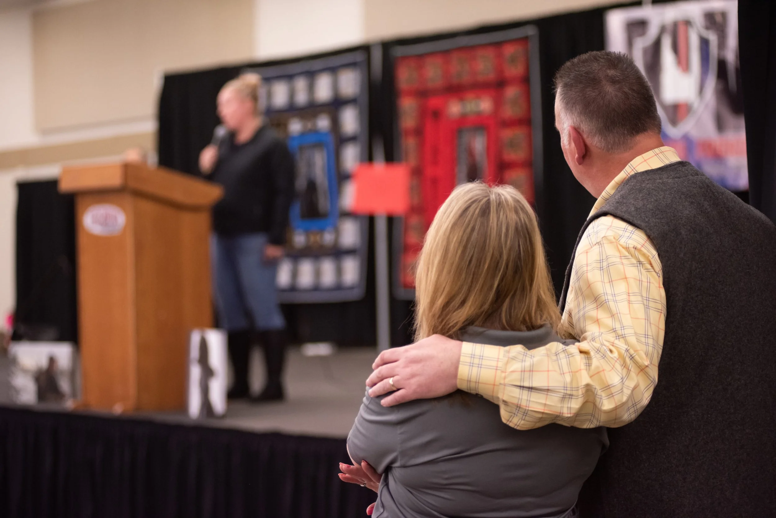 Sue Welch, non-profit founder, watching a speaker during the annual fundraiser