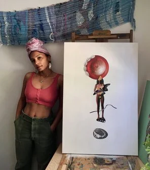Image of artist Calethia DeConto standing to the left of one of her pieces in her studio.