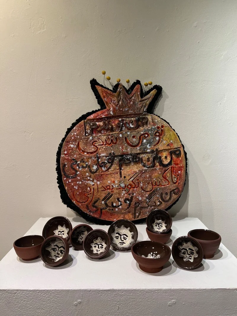 Zahra Hooshyar, Pomegranate Lover with Agha Khorshid Cups, ceramic and found fabrics, 36" x 40", 2022