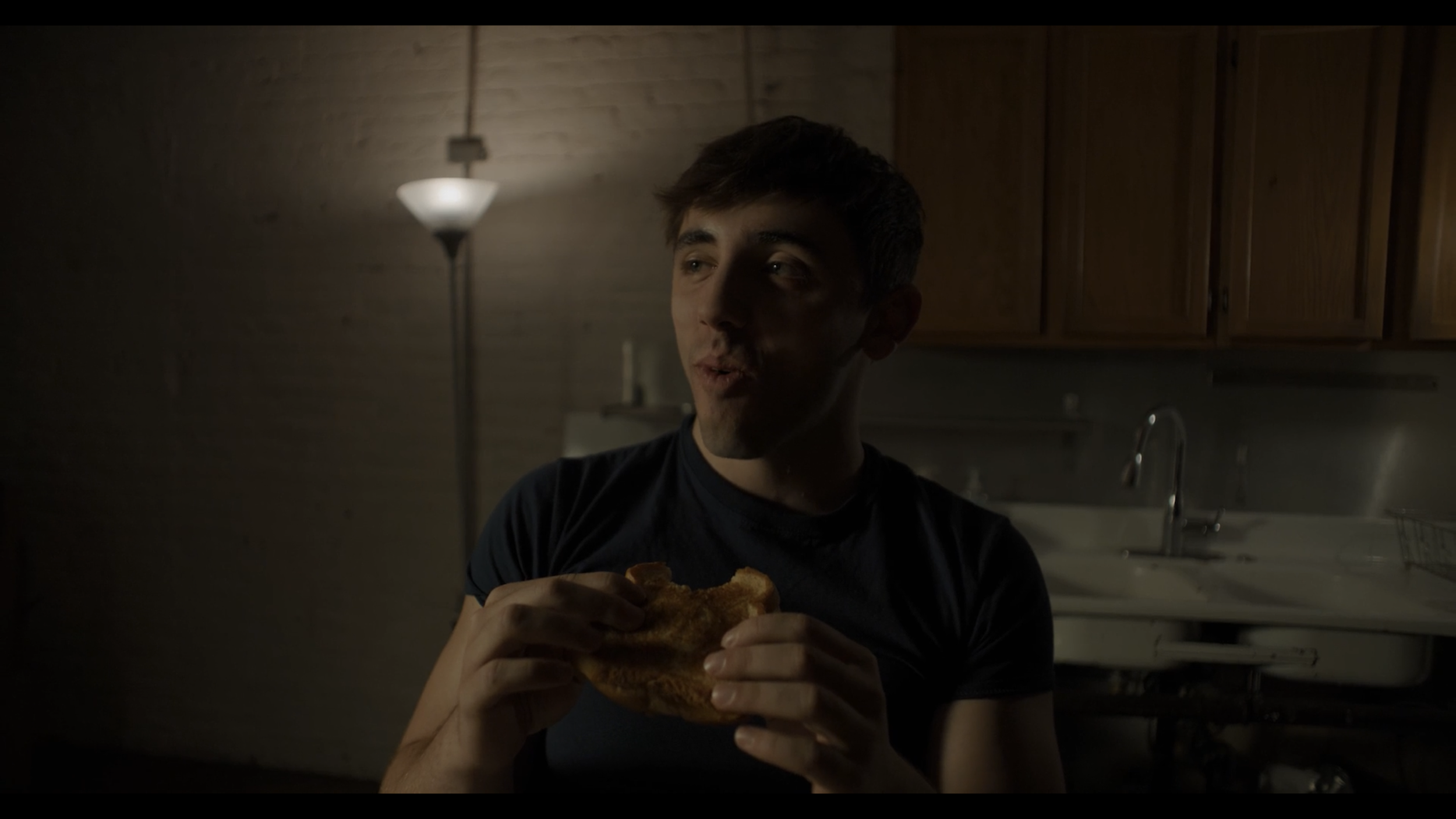 6. Lucas Eating Grilled Cheese.png