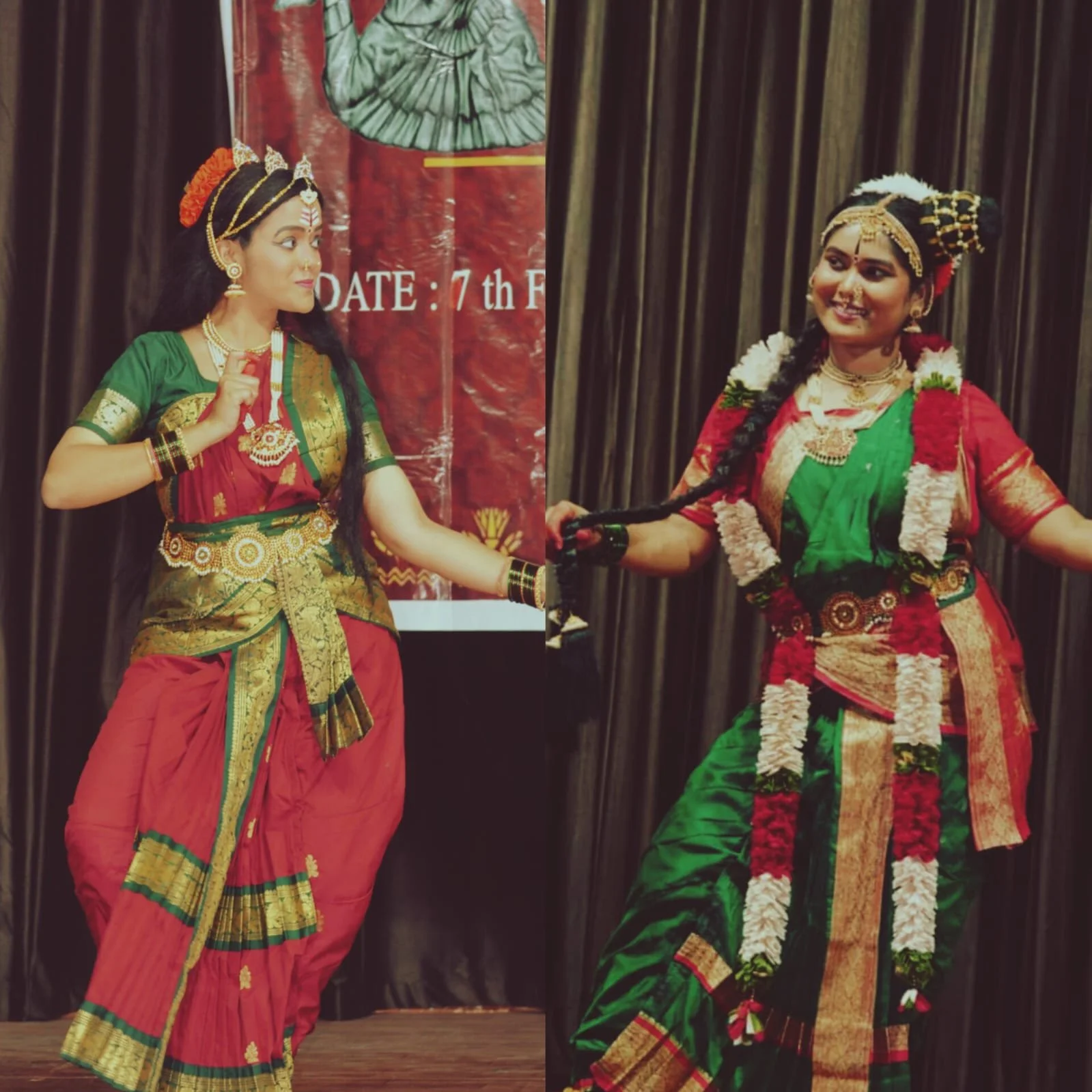 Two women dressed in traditional Indian attire performing a dance on stage with a dark curtain background.