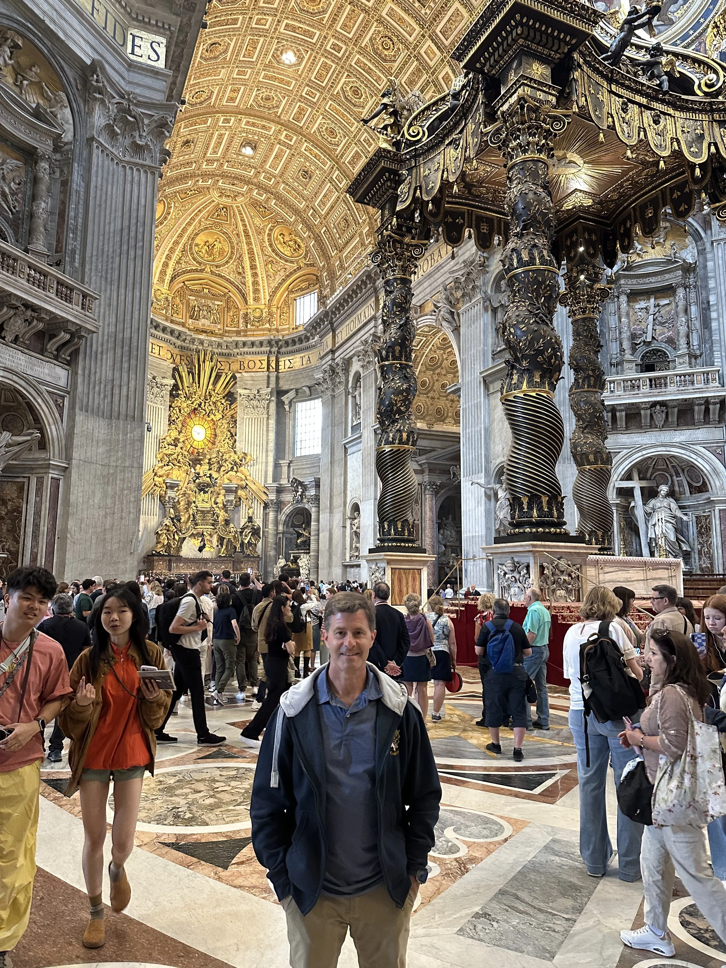 Michael Socha inside St. Peter's Basilica in Rome, beneath the dome.