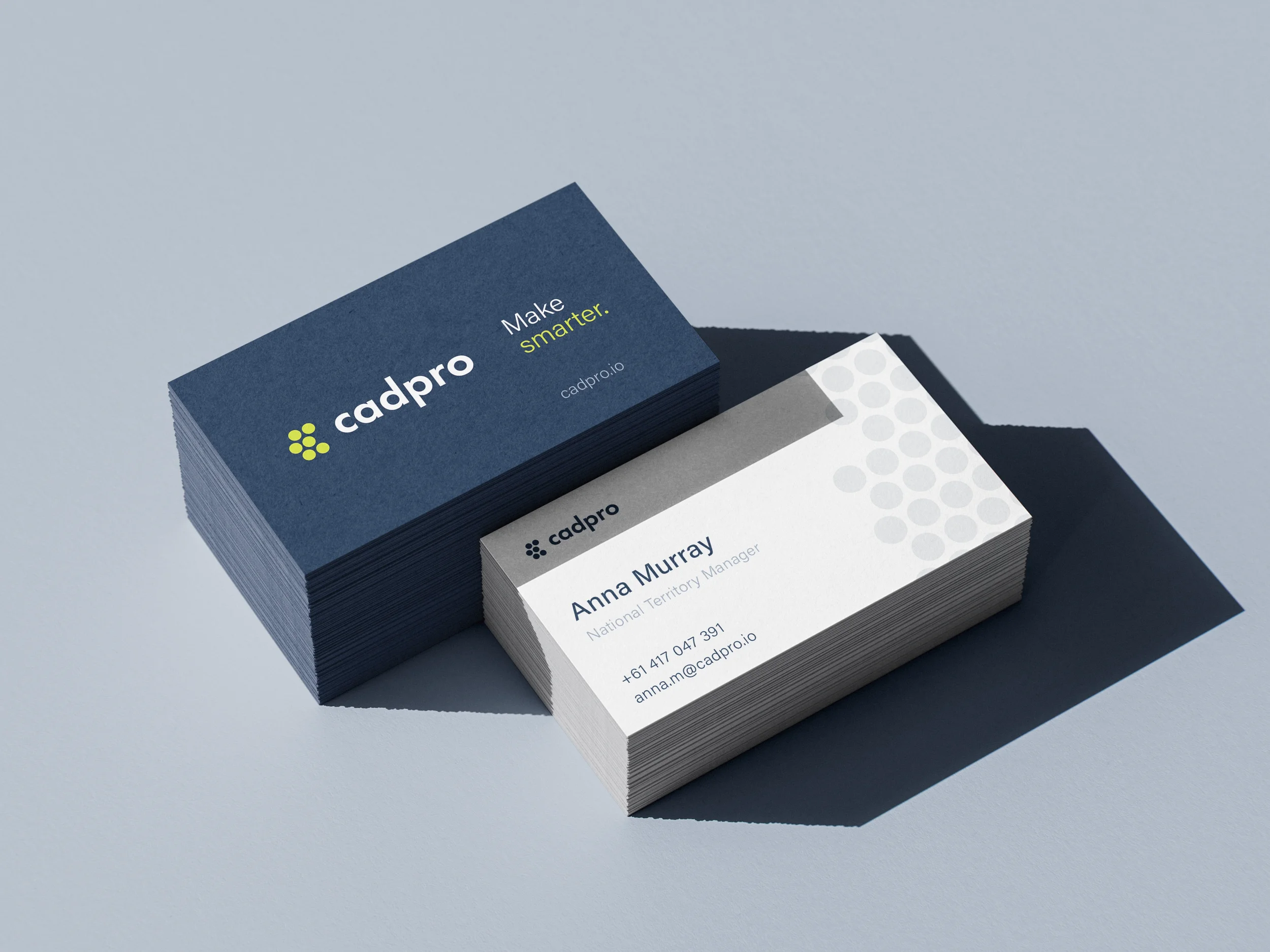Stack of business cards for Cadpro with the slogan "Make smarter." and a card displaying contact information for Anna Murray, National Territory Manager.