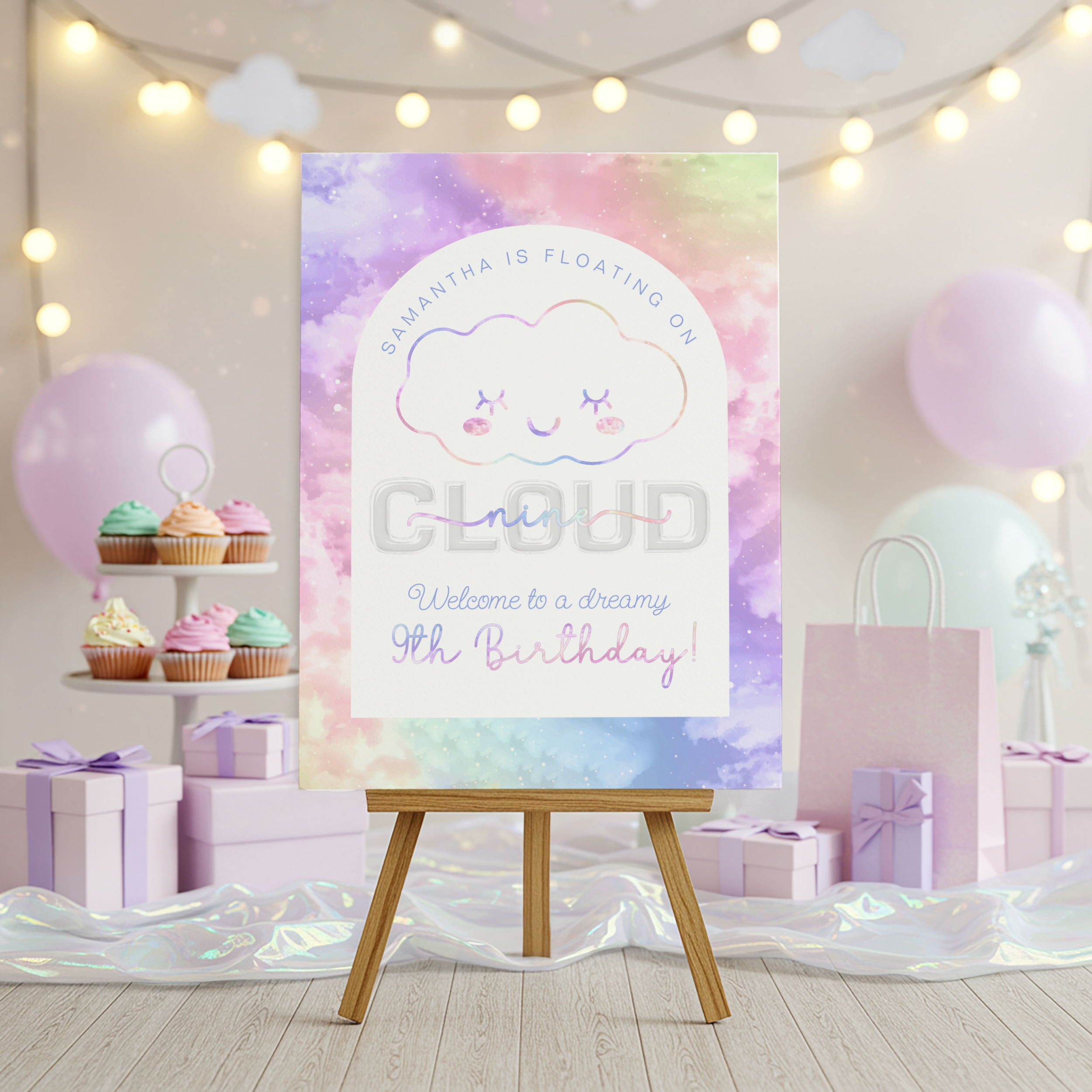 Cloud Nine birthday party welcome sign on wooden easel with pastel sky background and dreamy cloud theme decorations
