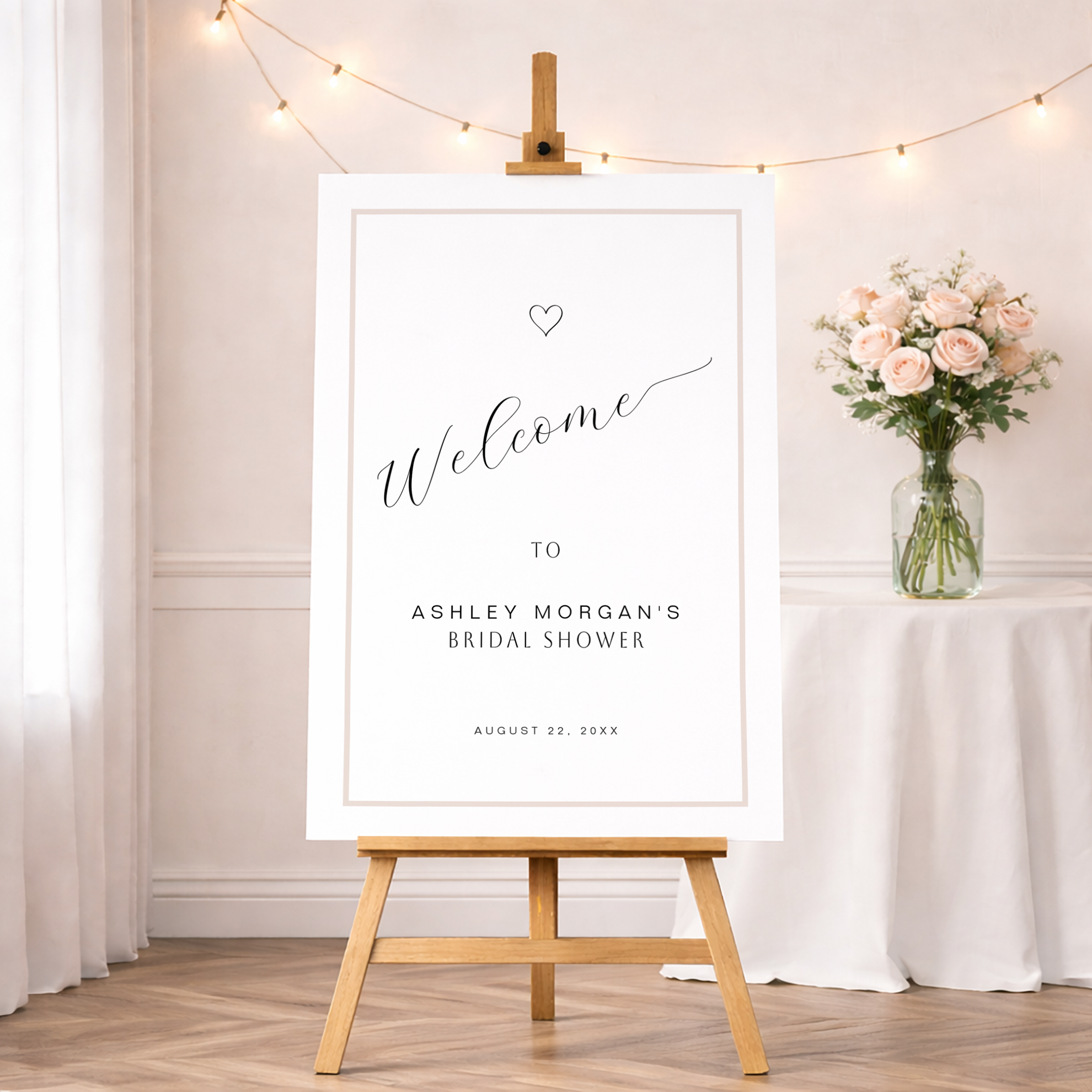 Minimal modern bridal shower welcome sign featuring elegant typography and neutral tones displayed on an easel.