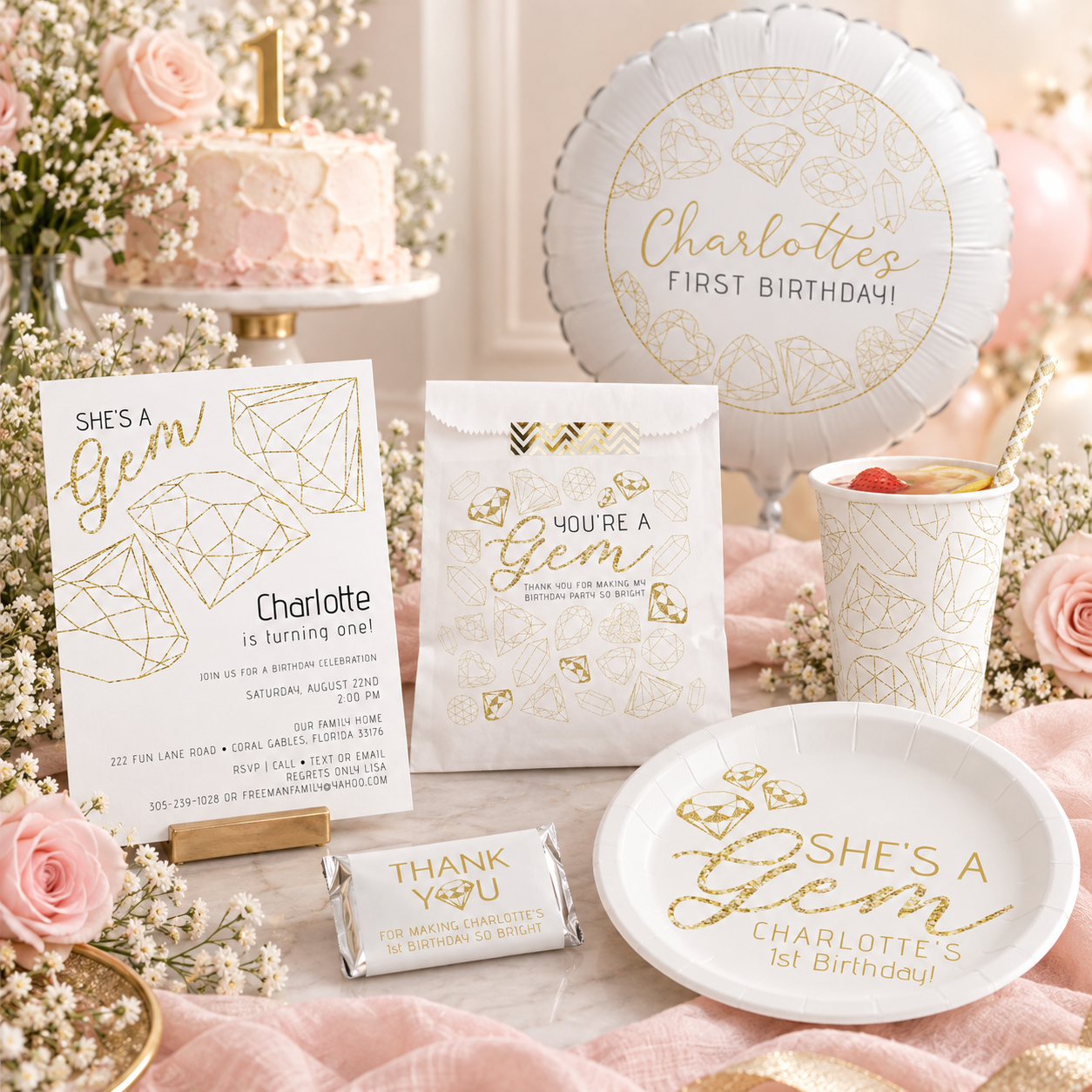Gemstone first birthday party collection styled with a She’s a Gem invitation, matching paper plate, gold gemstone cup, favor bag, favor wrapper, and first birthday balloon in a blush and gold party setting.