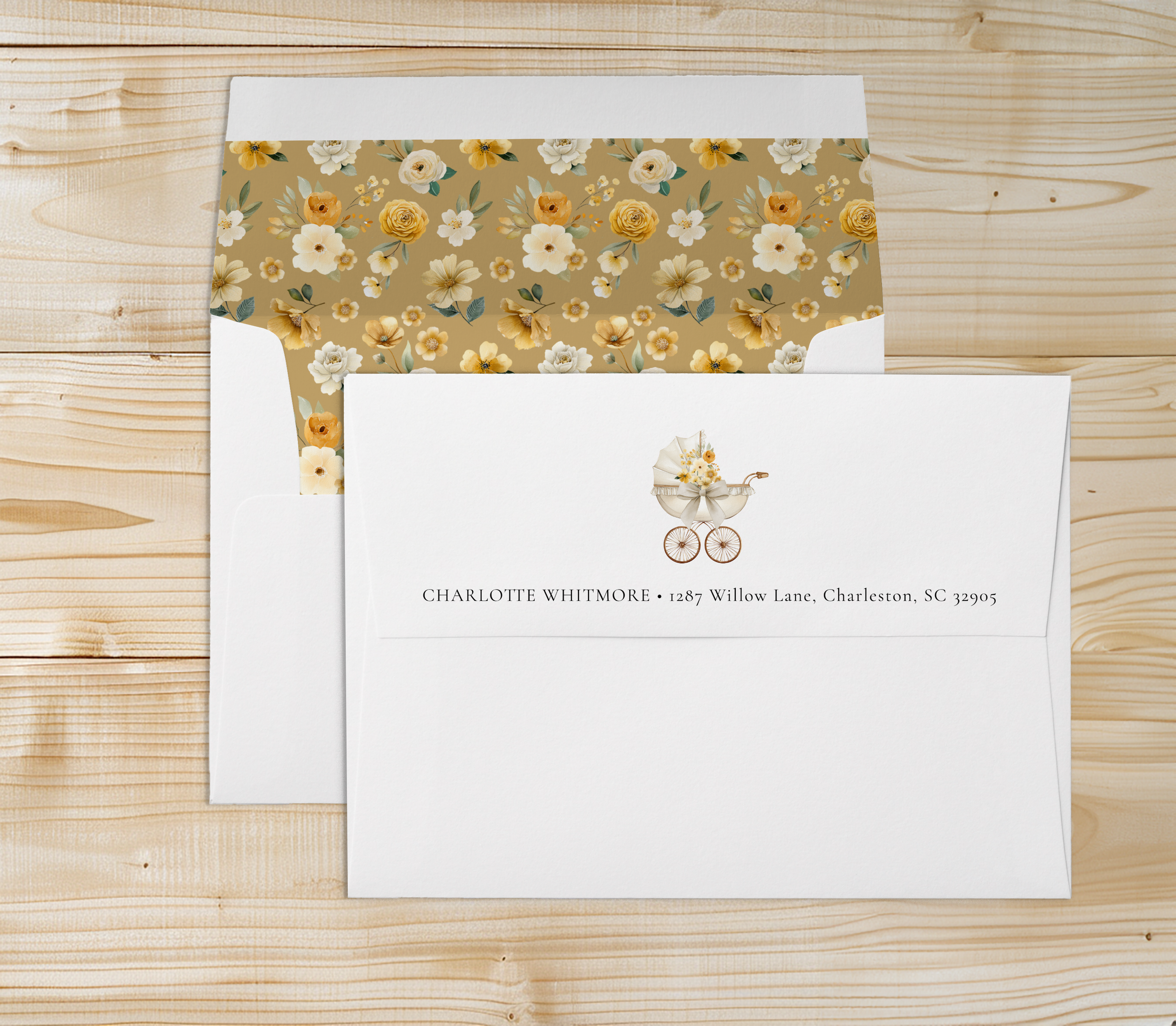 Neutral baby shower envelope with gold floral liner and carriage return address detail