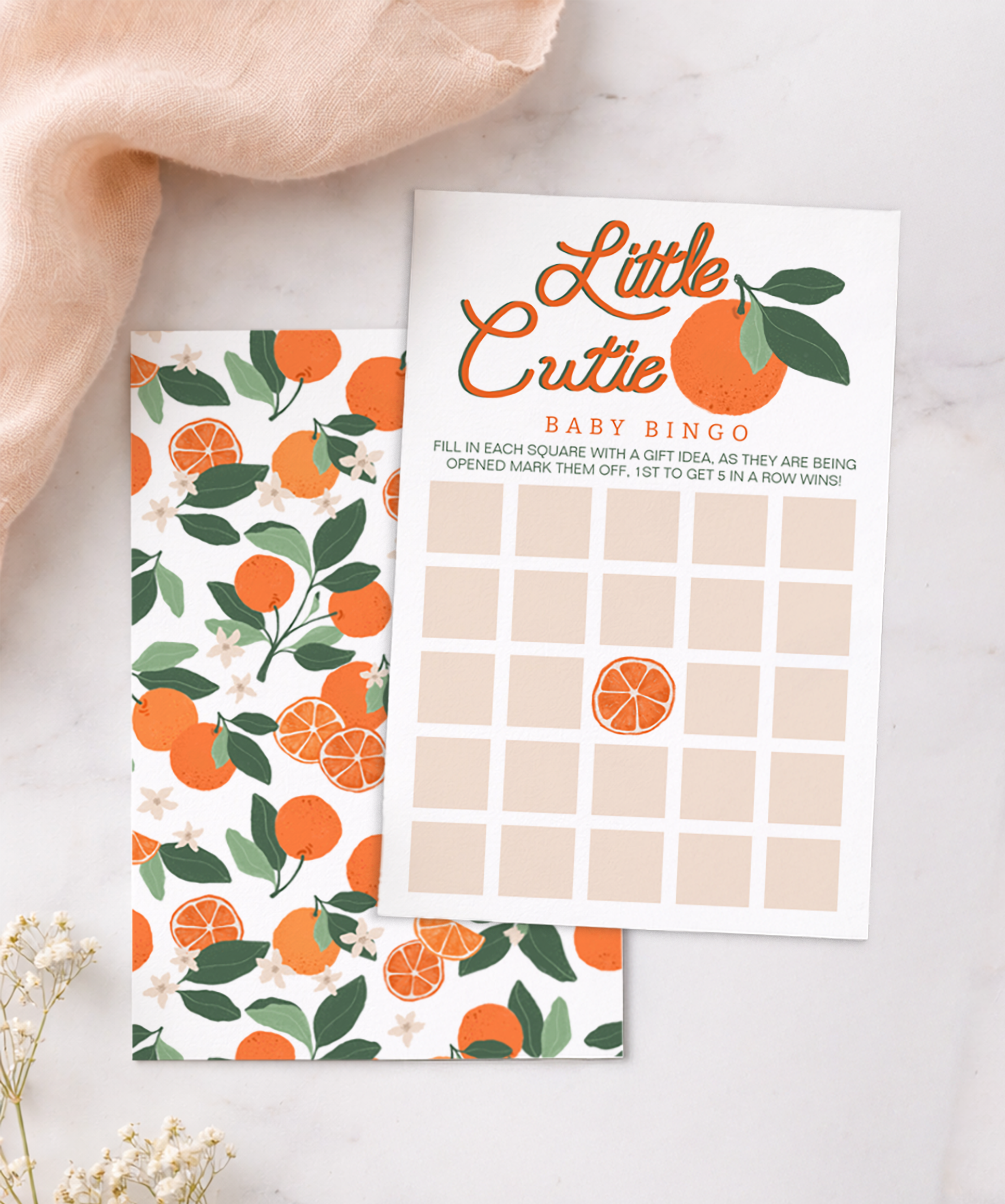 Little Cutie baby shower bingo game card with soft orange and greenery design and neutral background.