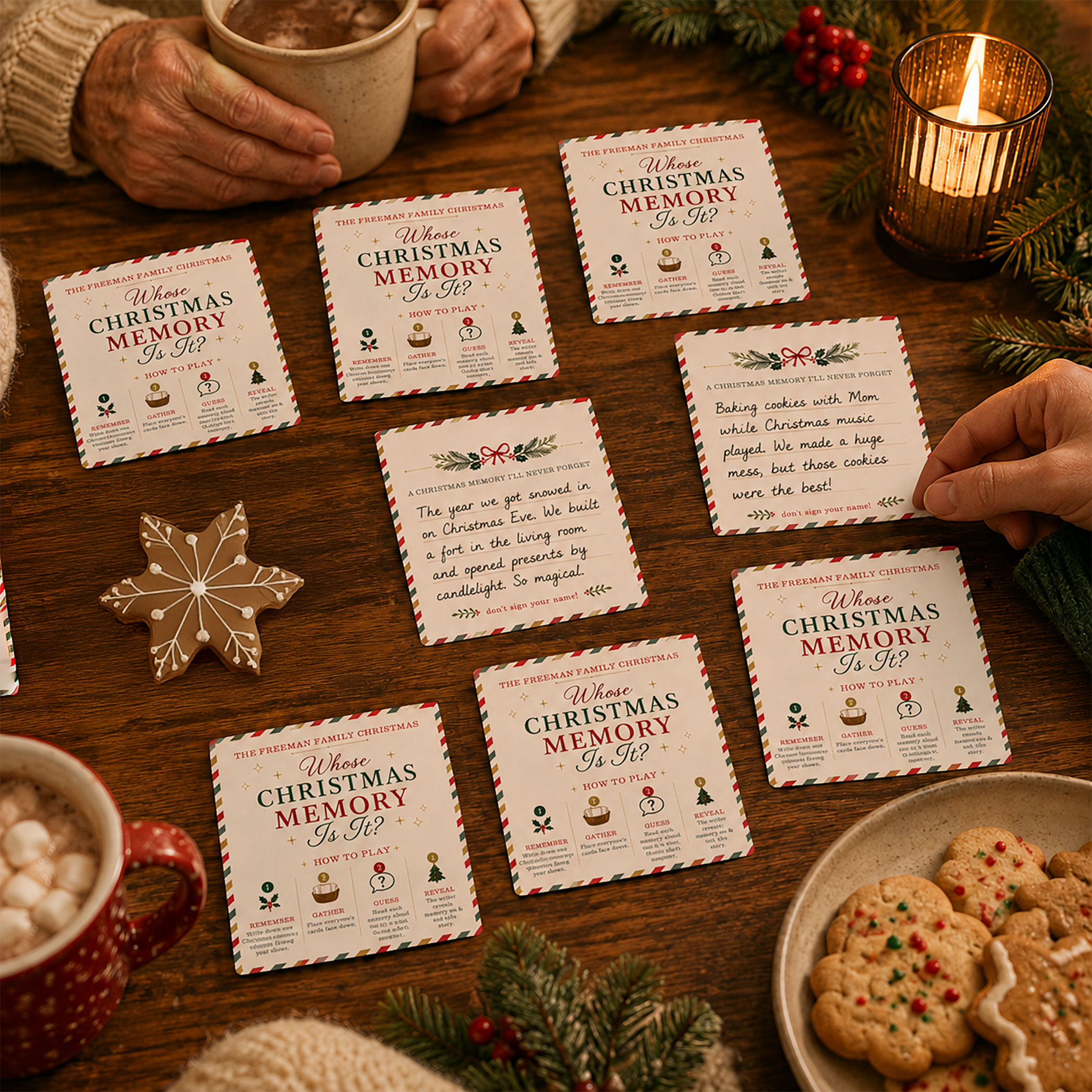 Family playing Whose Christmas Memory Is It? with Christmas memory cards spread across a wooden holiday table beside hot cocoa, cookies, candles, evergreen branches, and festive decorations.