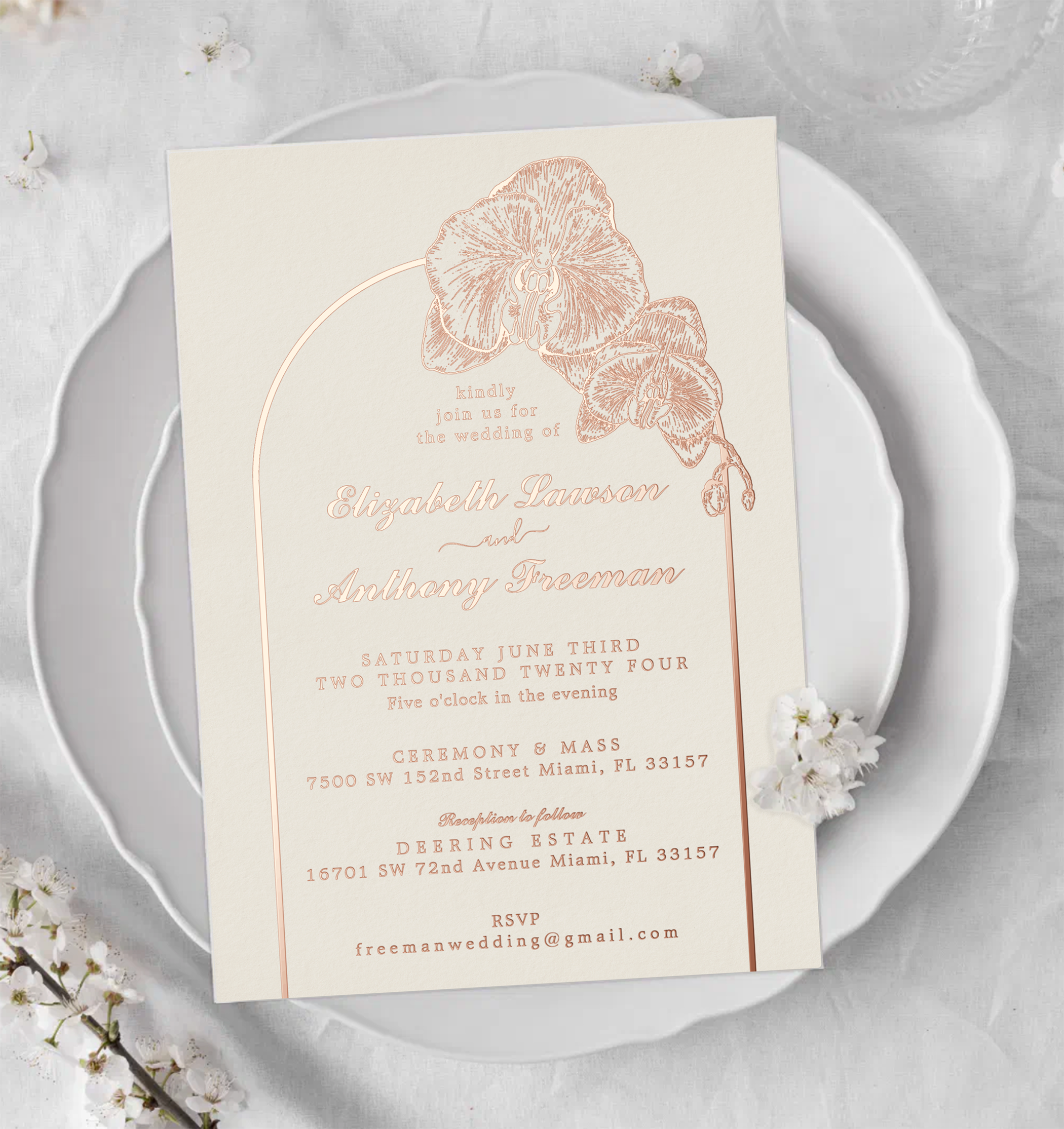 Romantic orchid arch wedding invitation with delicate floral foil details on ivory cardstock.