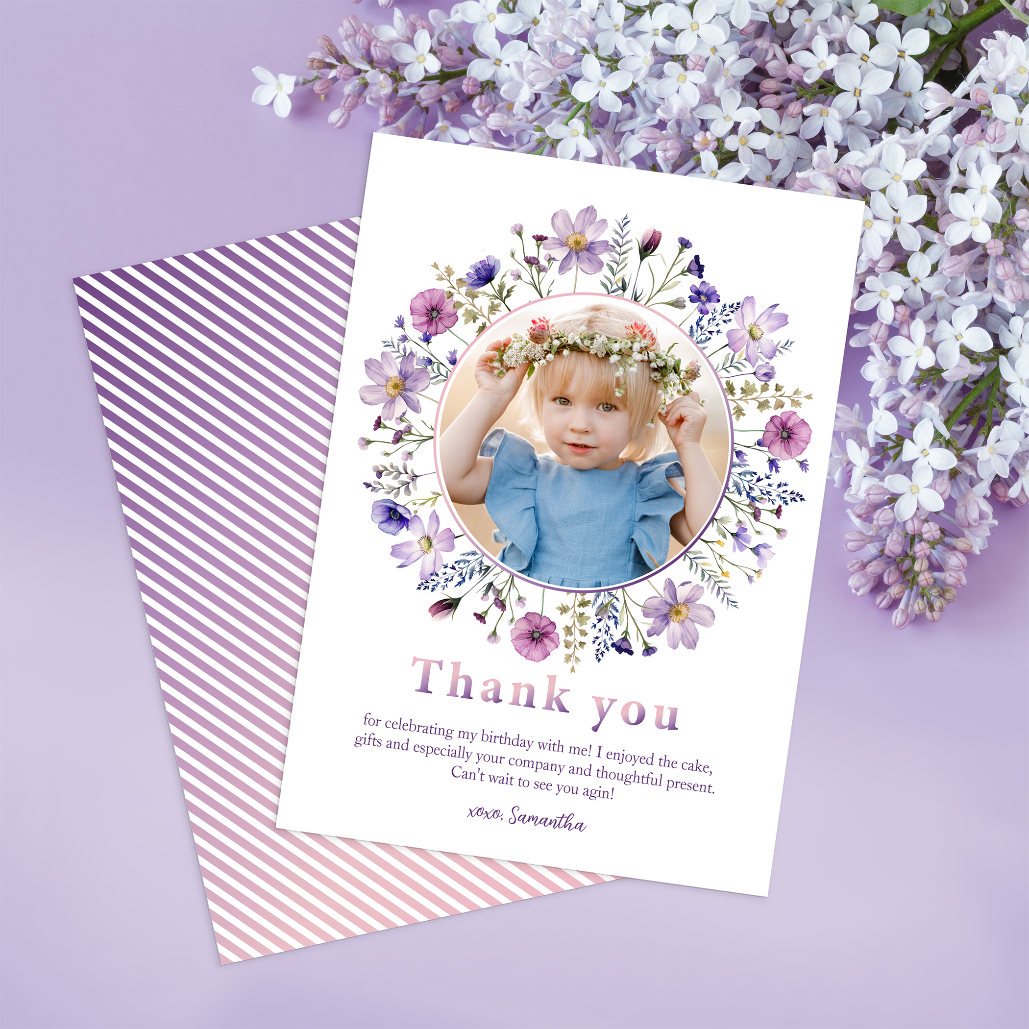Purple wildflower first birthday thank you card with a personalized child photo and soft butterfly floral design.