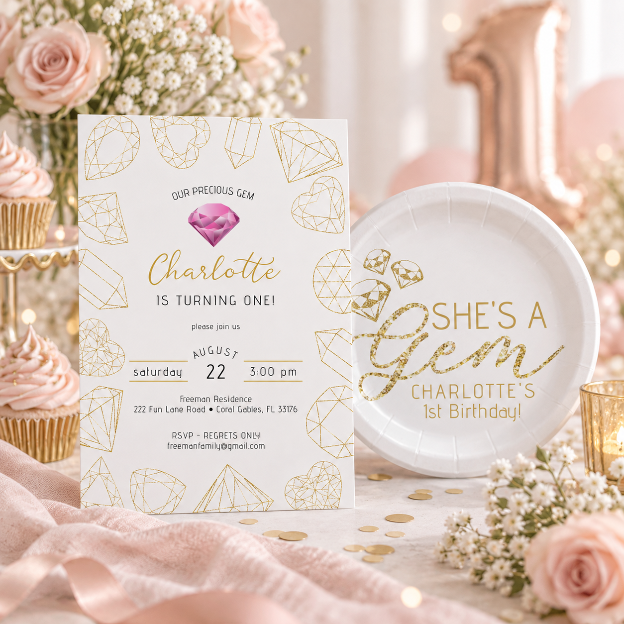 Gemstone first birthday invitation and matching She’s a Gem paper plate styled with blush cupcakes, pink roses, baby’s breath, and gold party accents.