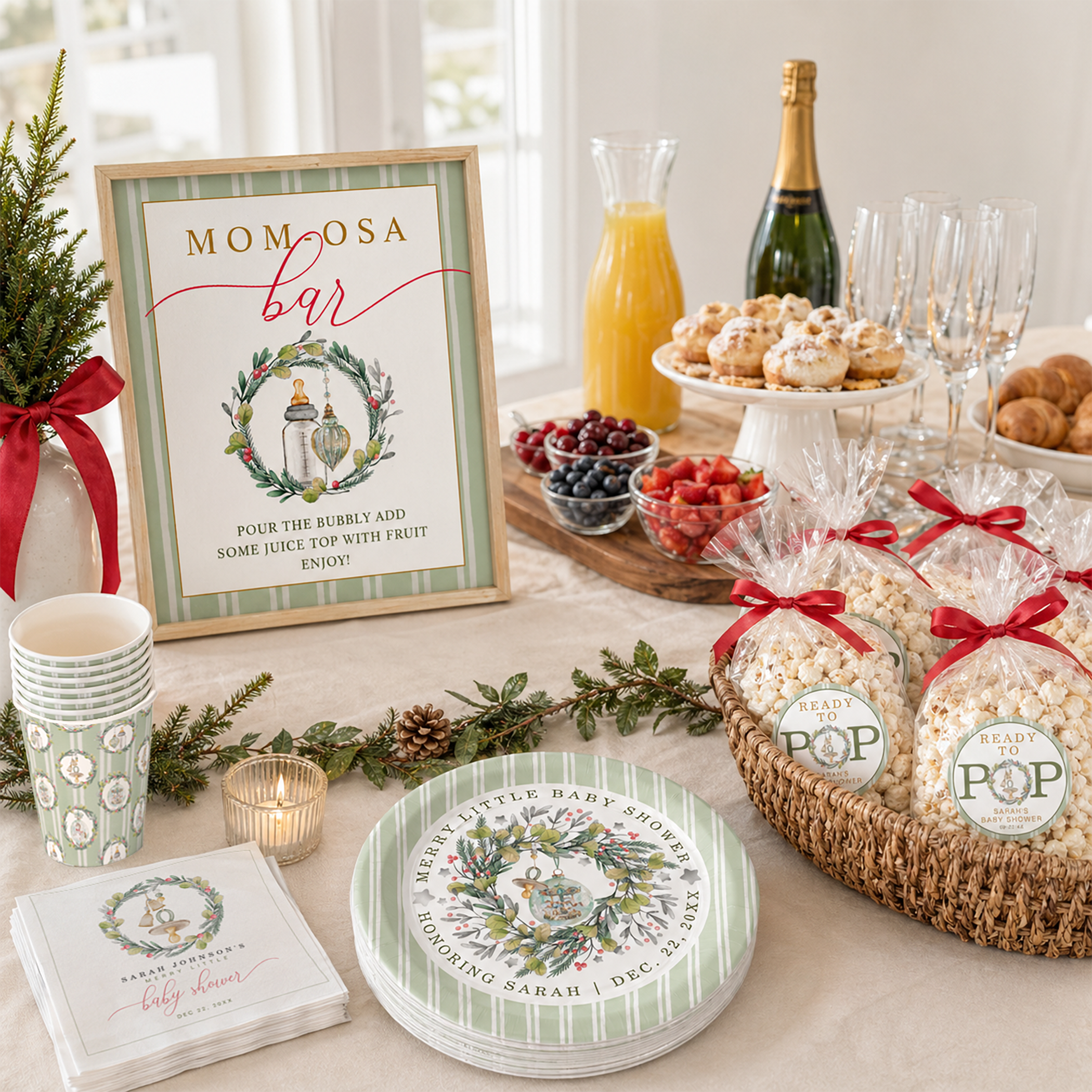 Elegant holiday baby shower buffet table featuring sage green striped paper plates, cups, and napkins, framed Mom-osa bar sign