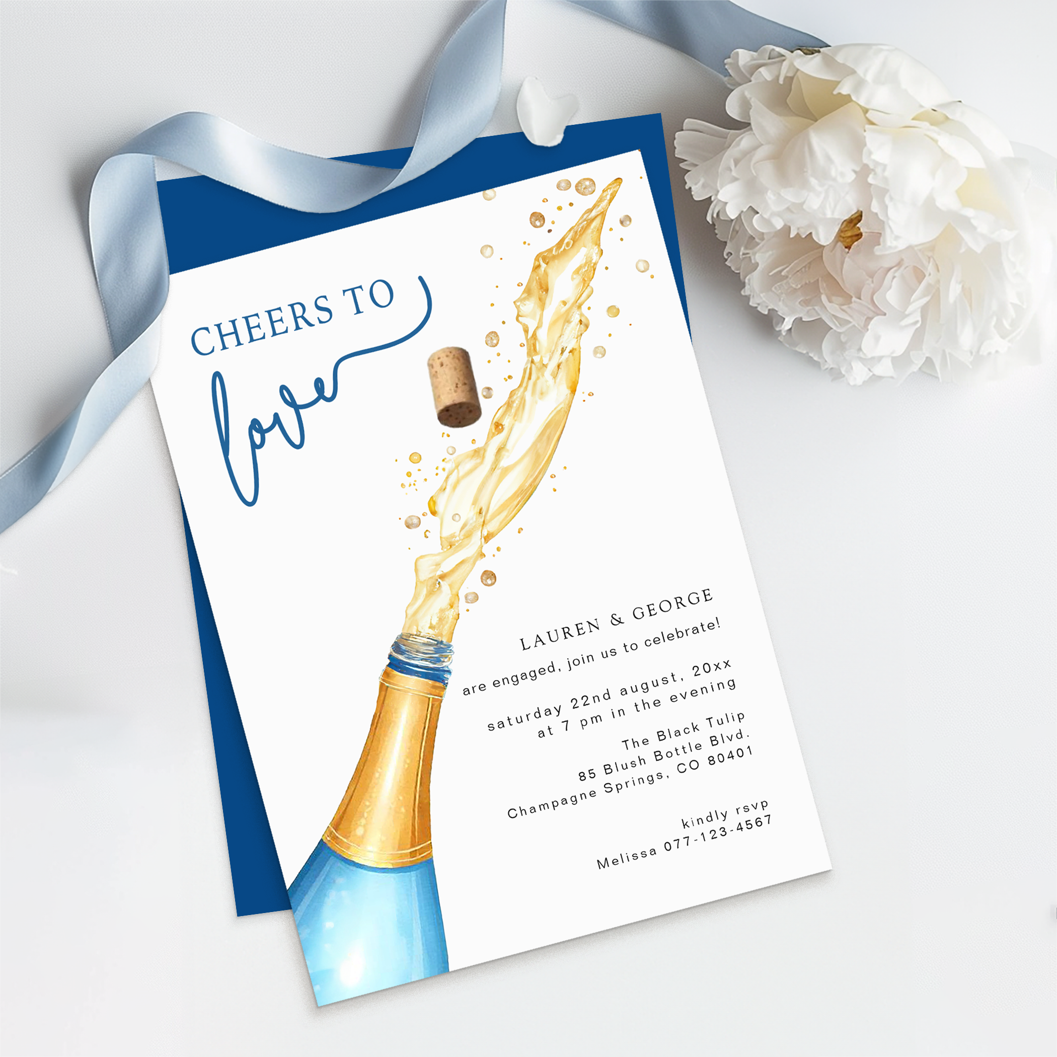 Something Blue Before I Do bridal shower invitation with champagne bottle, flutes, soft blue florals, and romantic calligraphy.