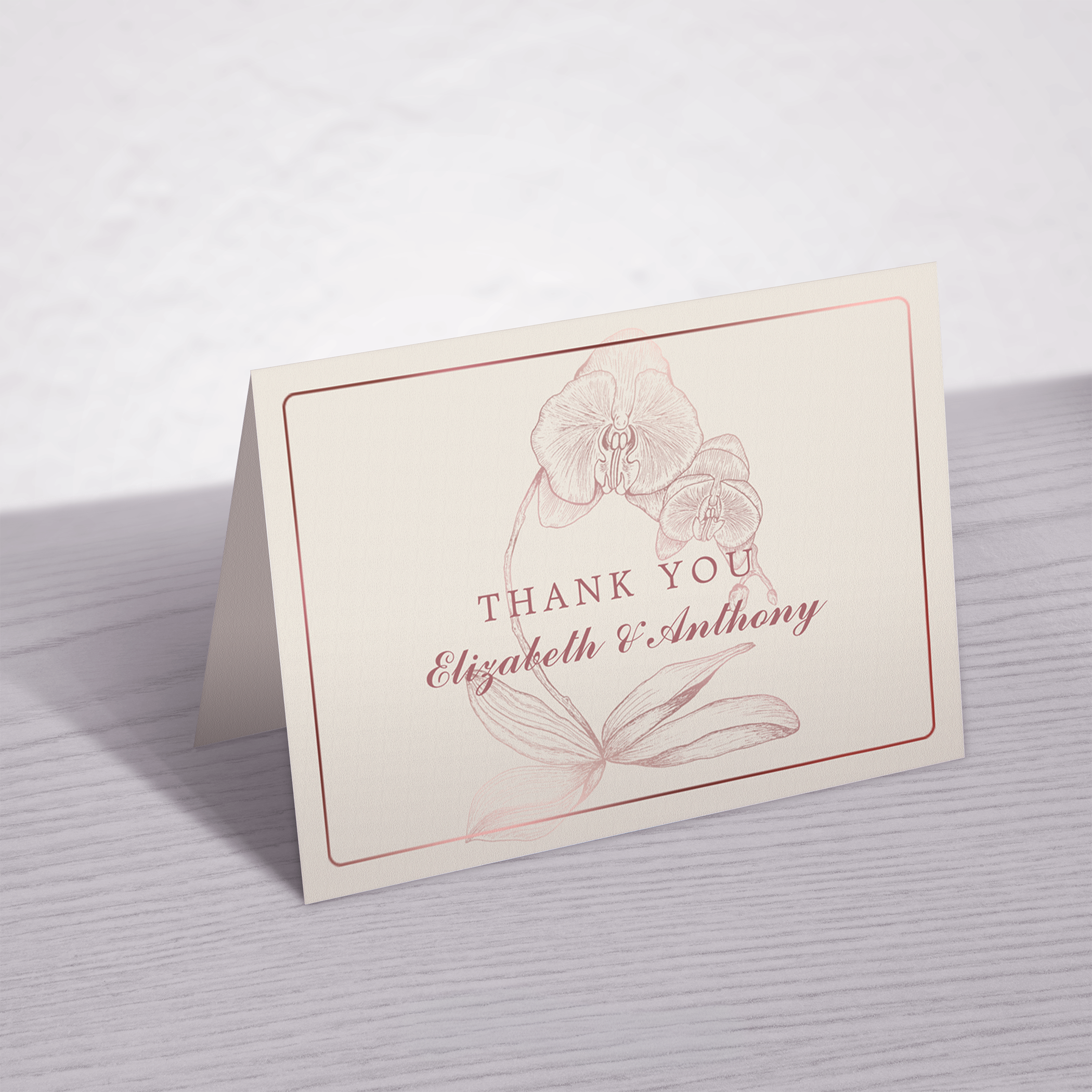 Botanical orchid wedding thank you card with monogram and space for handwritten message.