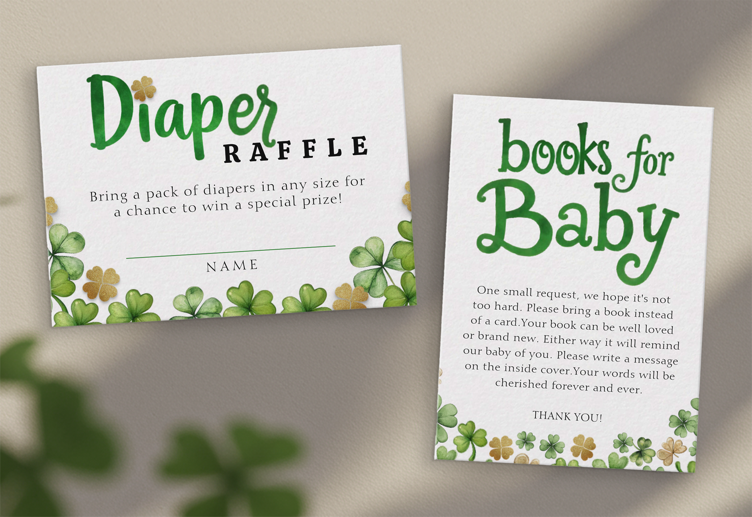 Lucky Charm baby shower insert cards featuring a diaper raffle card and a books for baby request card with watercolor clovers and green typography.