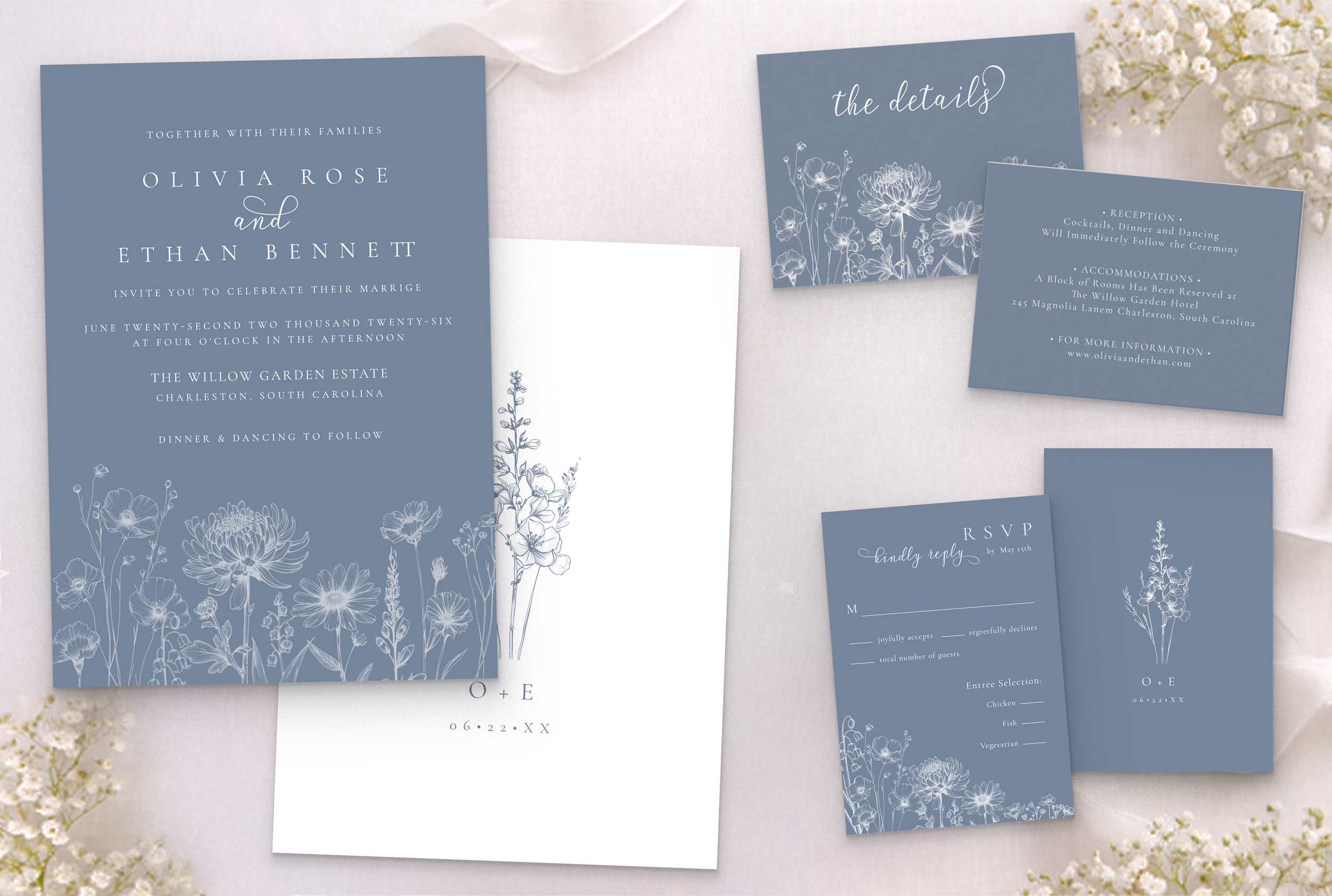 Periwinkle blue botanical wedding invitation suite with RSVP card, details card, and envelope in soft muted blue tones