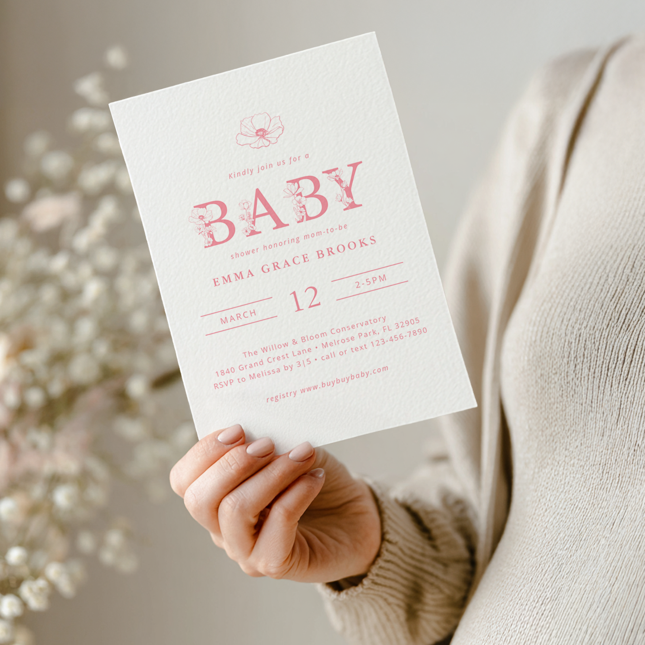 Dusty pink wildflower baby shower invitation with floral lettering and soft romantic pink design.