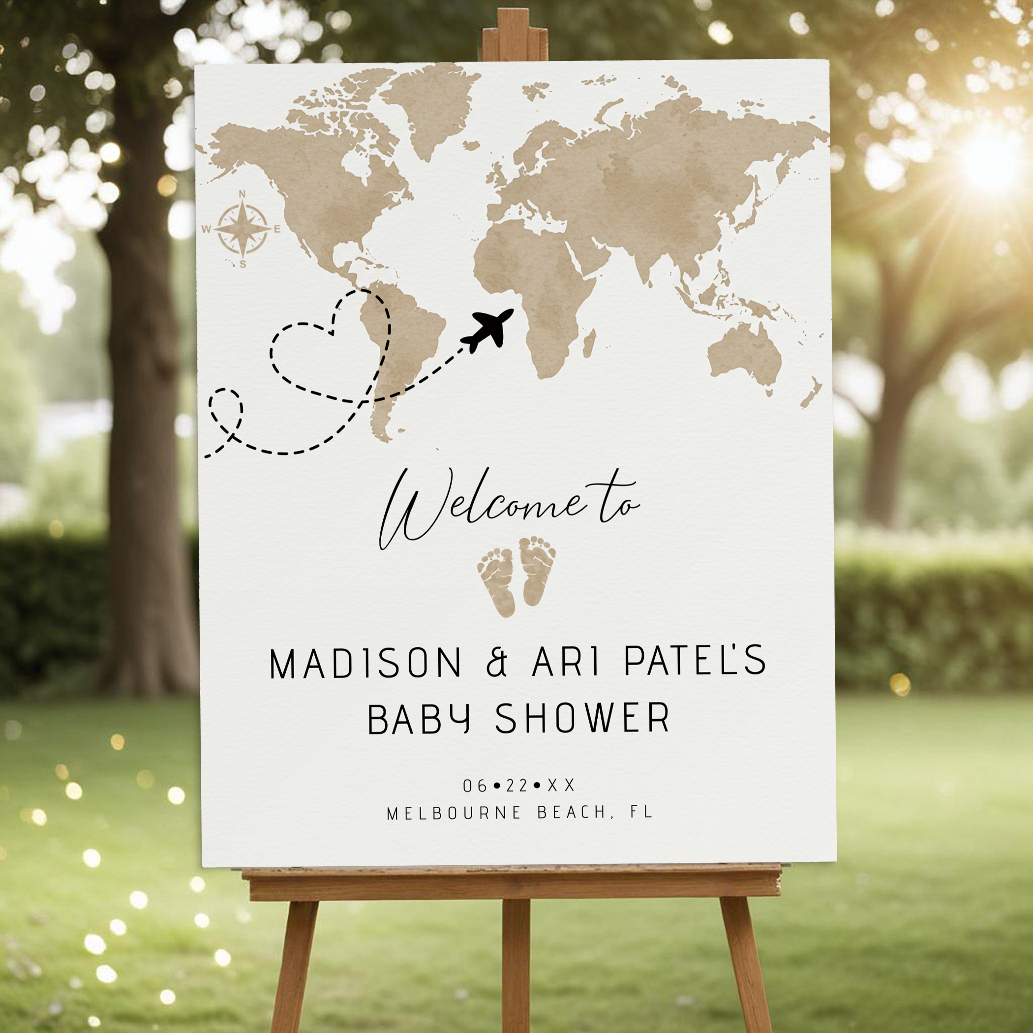 Travel baby shower welcome sign with airplane heart path over world map.