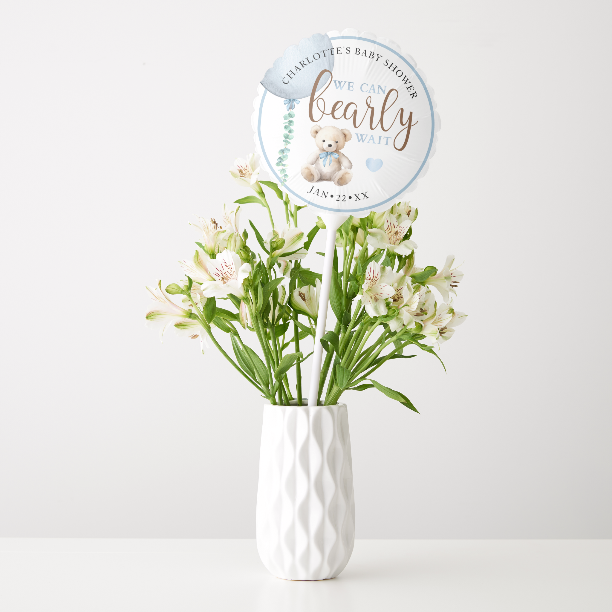 Blue teddy bear baby shower balloon decoration centerpiece with “We Can Bearly Wait” design.