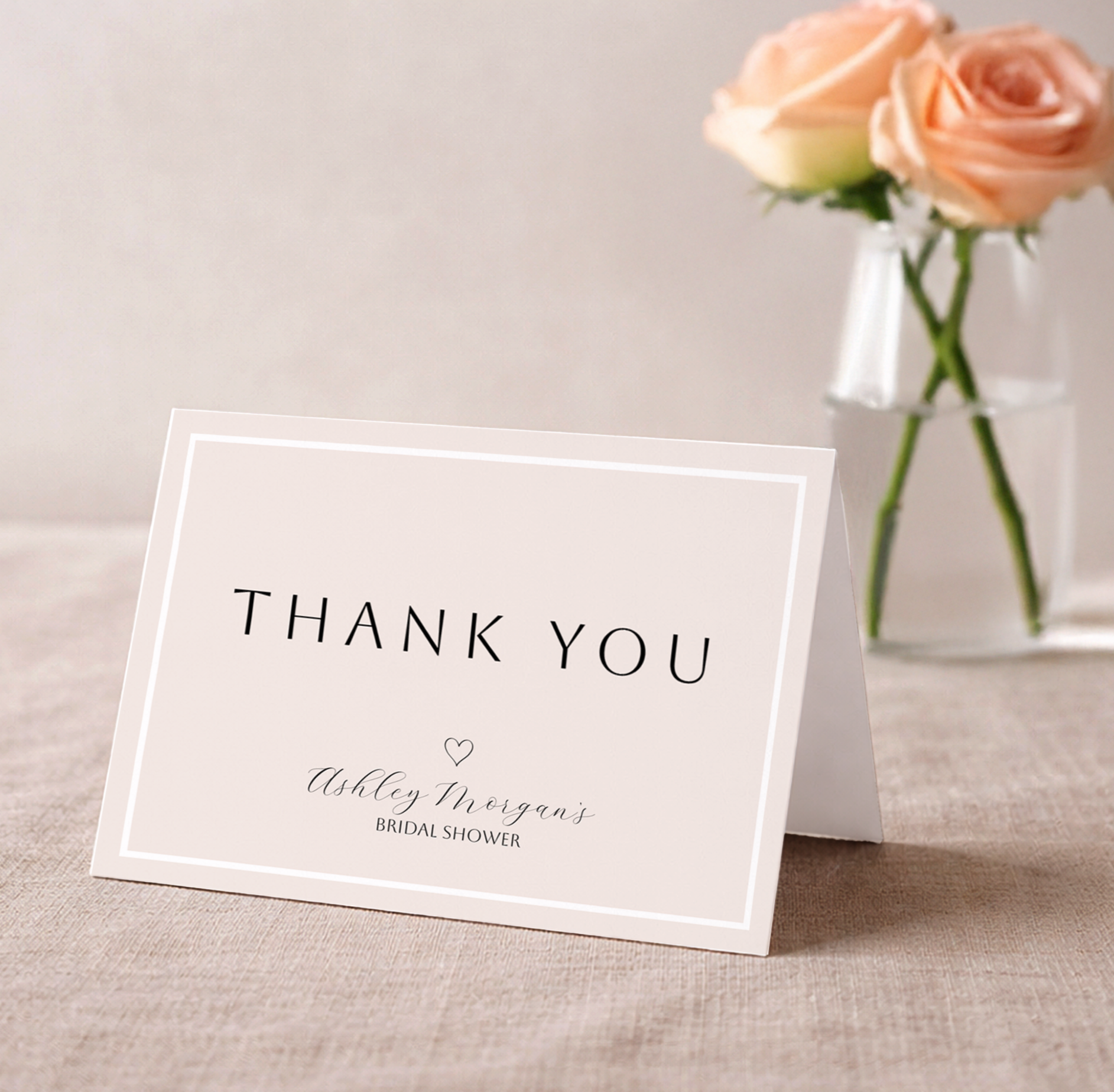 Minimal modern bridal shower thank you card with elegant calligraphy on a neutral background.