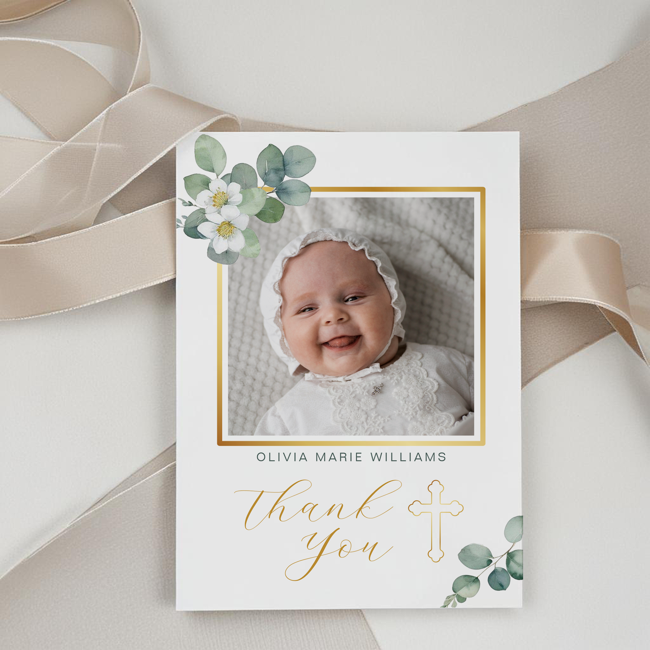 Elegant baptism invitation featuring two baby photos, gold cross border, and modern typography on a clean white background.