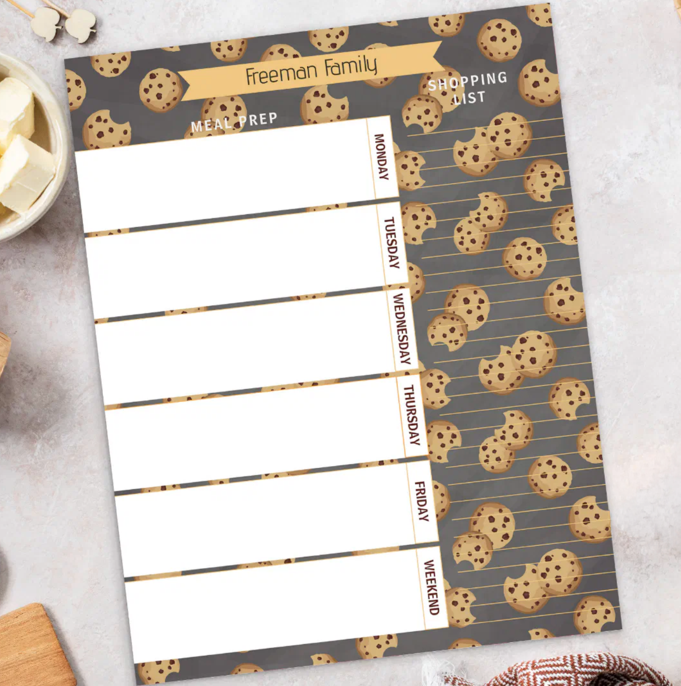 Chocolate chip cookie themed weekly meal planner and grocery shopping list with personalized family name and playful kitchen styling.
