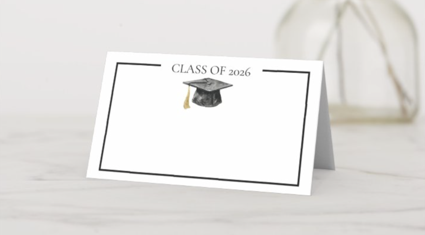 Black and white graduation place card with graduation cap design