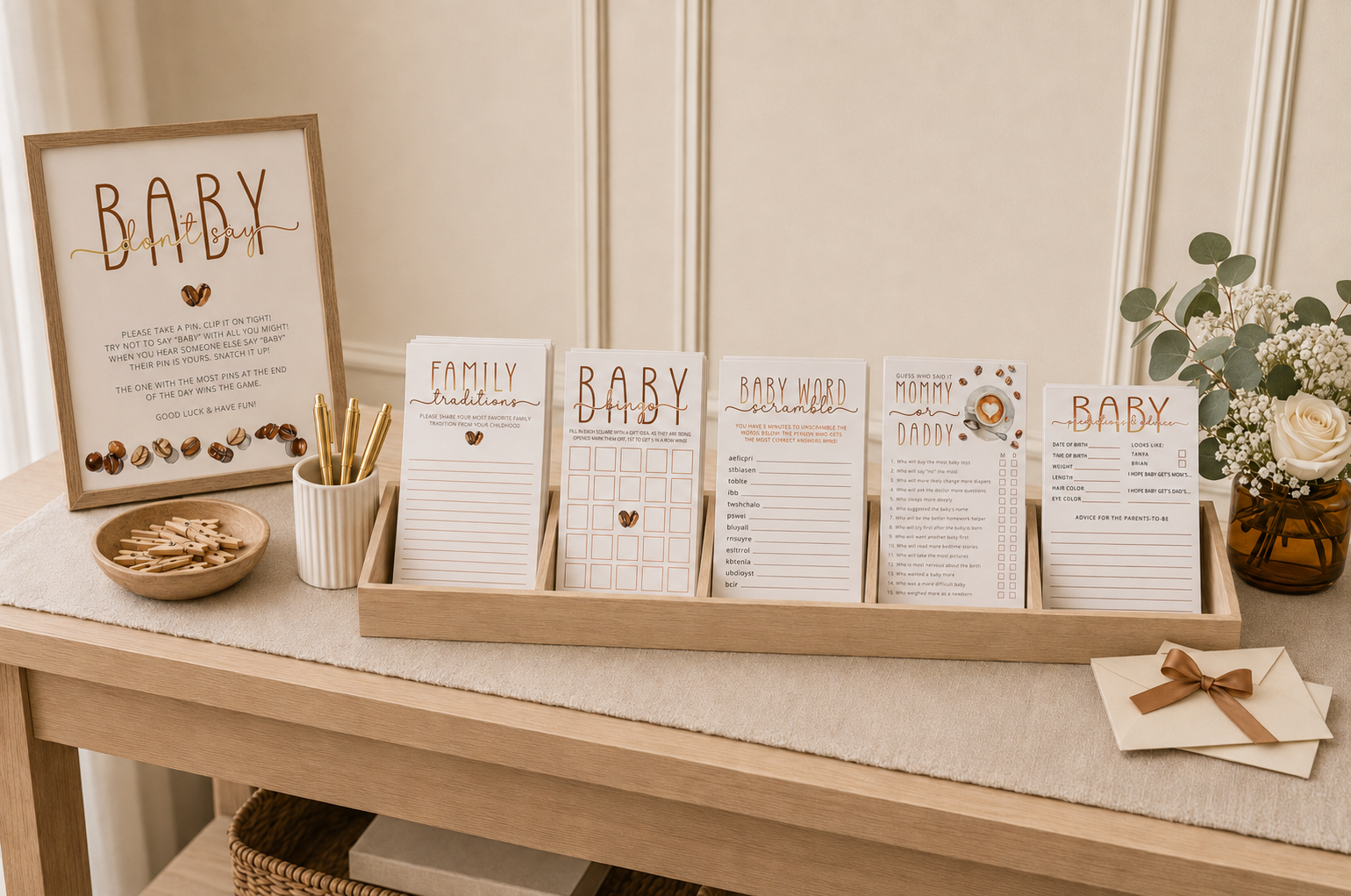 Coffee-themed baby shower game station with bingo, word scramble, Mommy or Daddy, predictions, and family tradition cards.