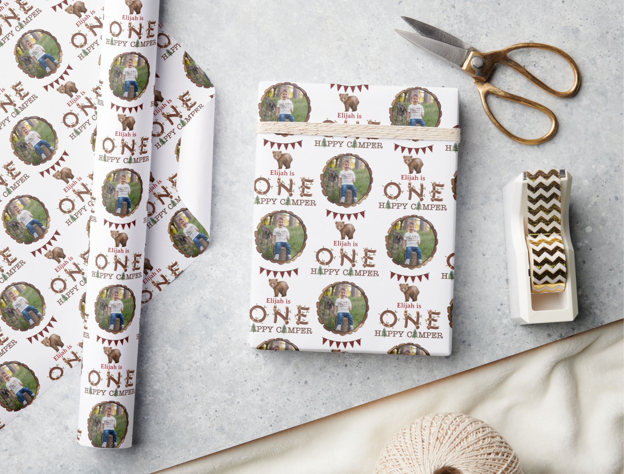 One Happy Camper custom rustic wrapping paper with repeating woodland birthday pattern