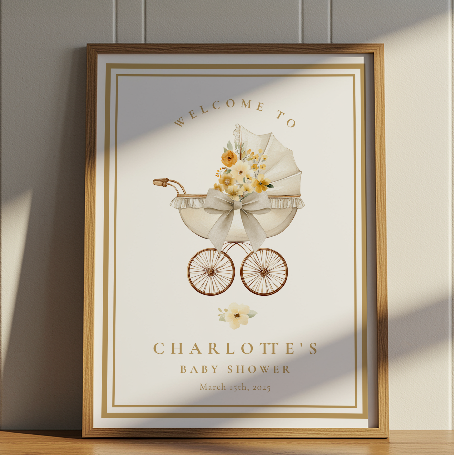 Gold framed baby shower welcome sign featuring vintage carriage design