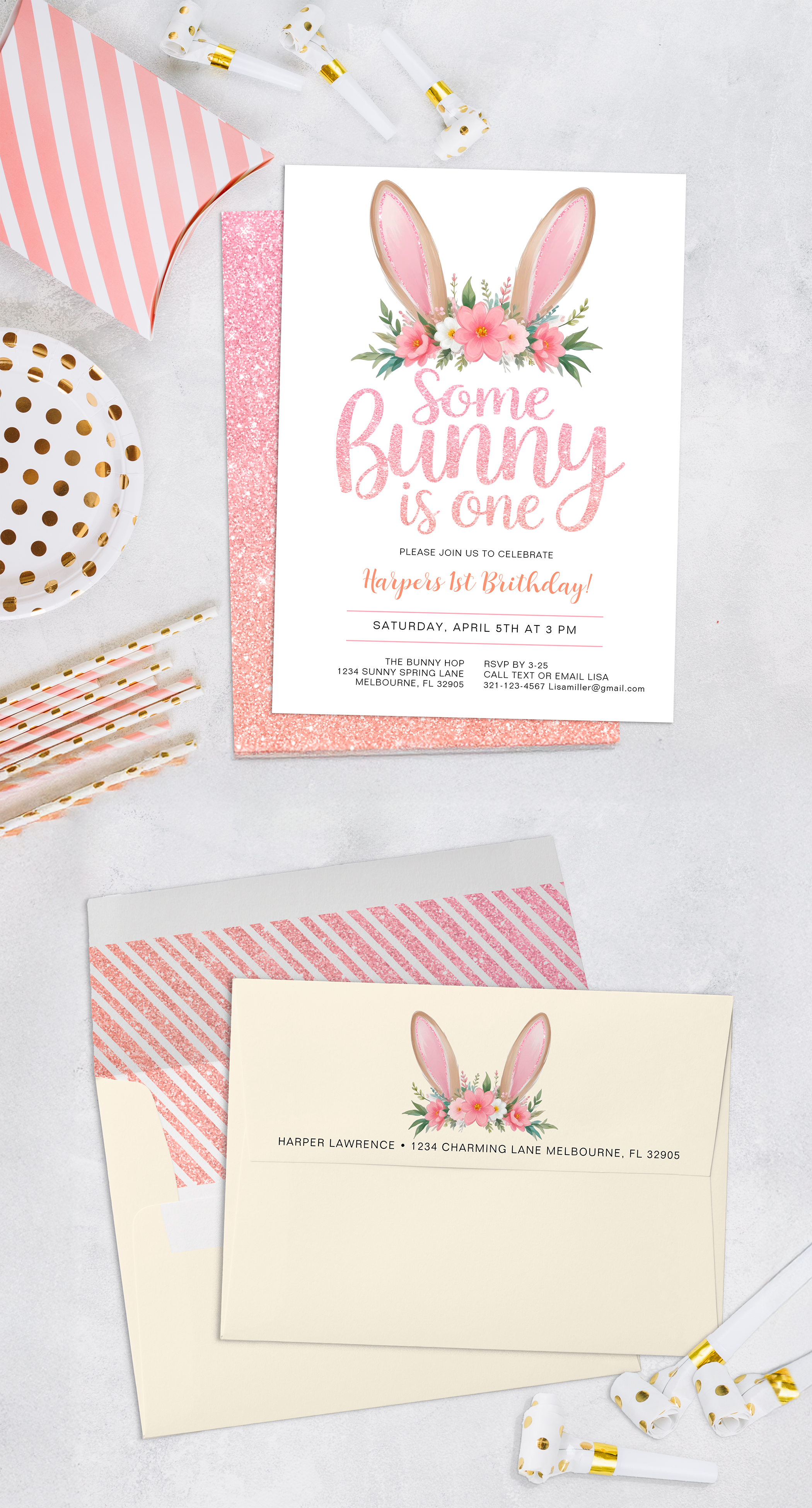 Some Bunny Is One first birthday invitation with pink floral bunny ears, styled with matching envelope and pastel party decor.