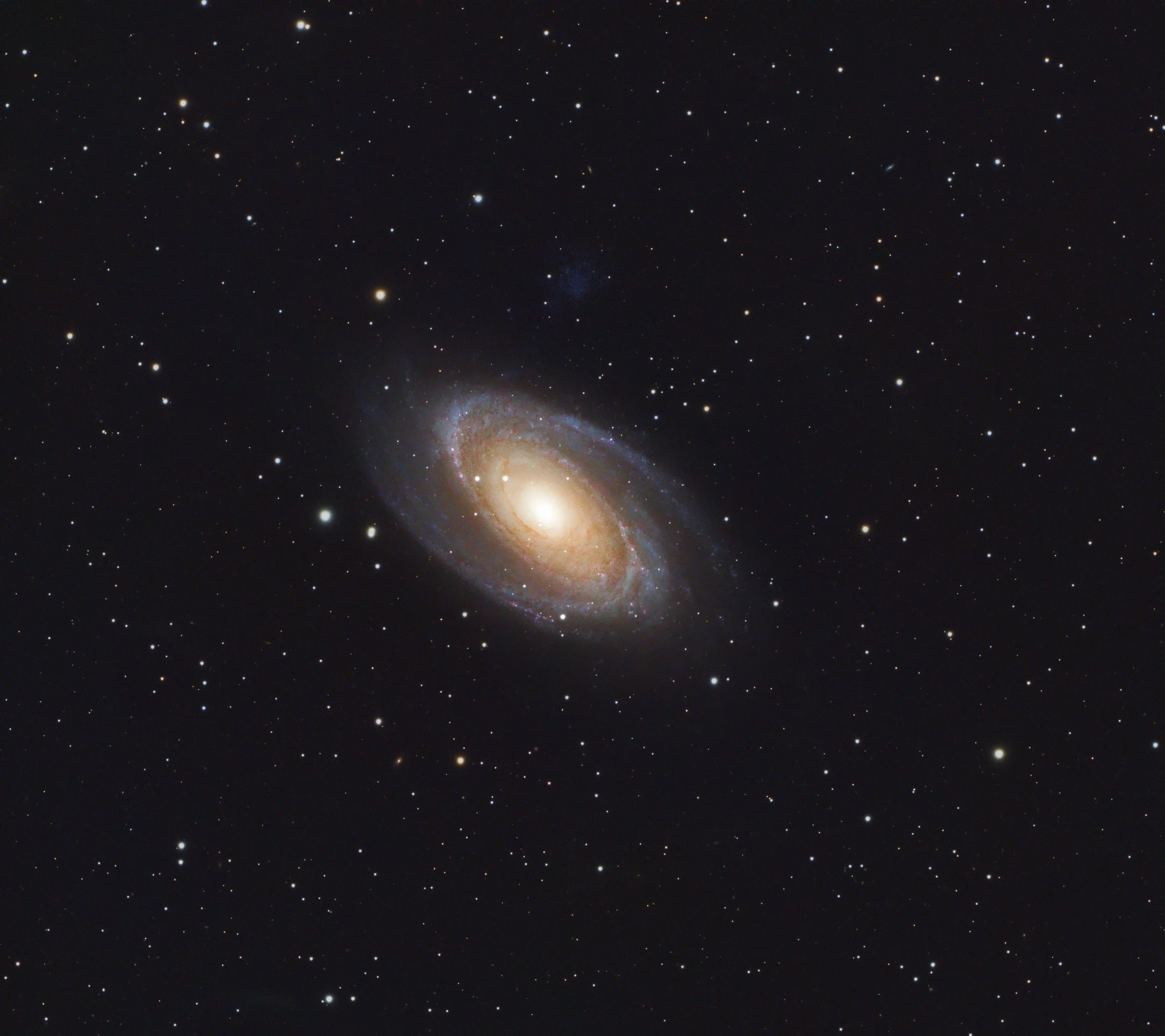 A galaxy surrounded by numerous stars in deep space.